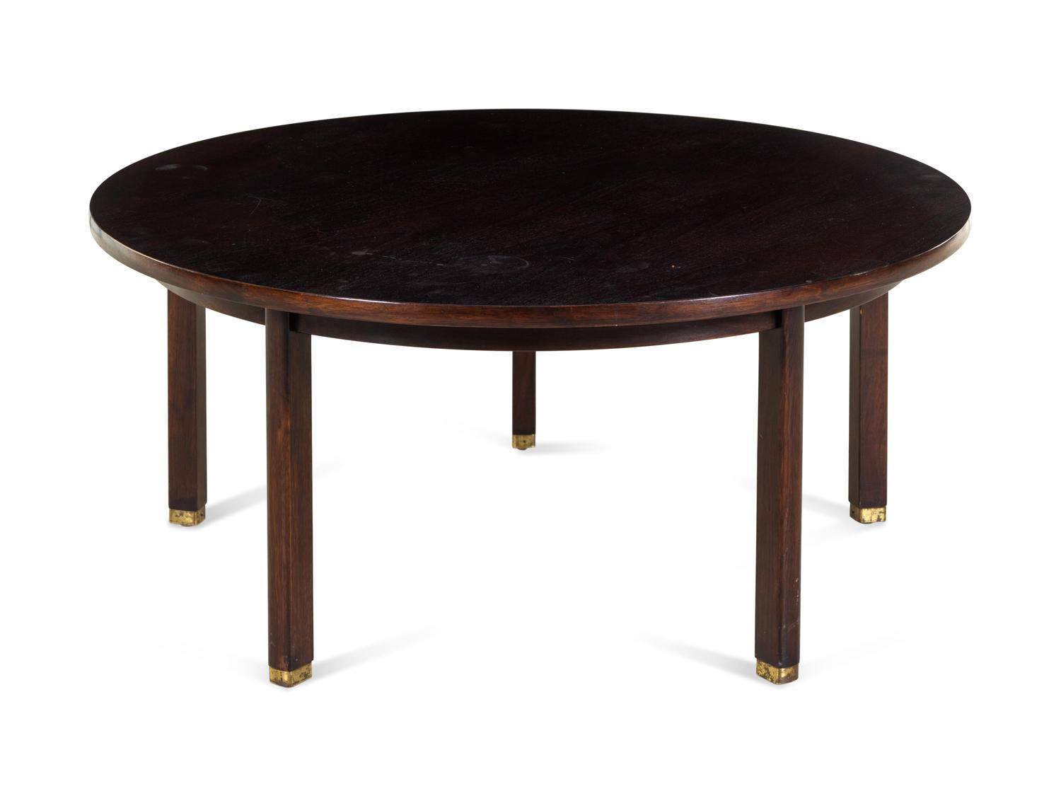A Dunbar Lacquered and Brass Mounted Circular Low Table