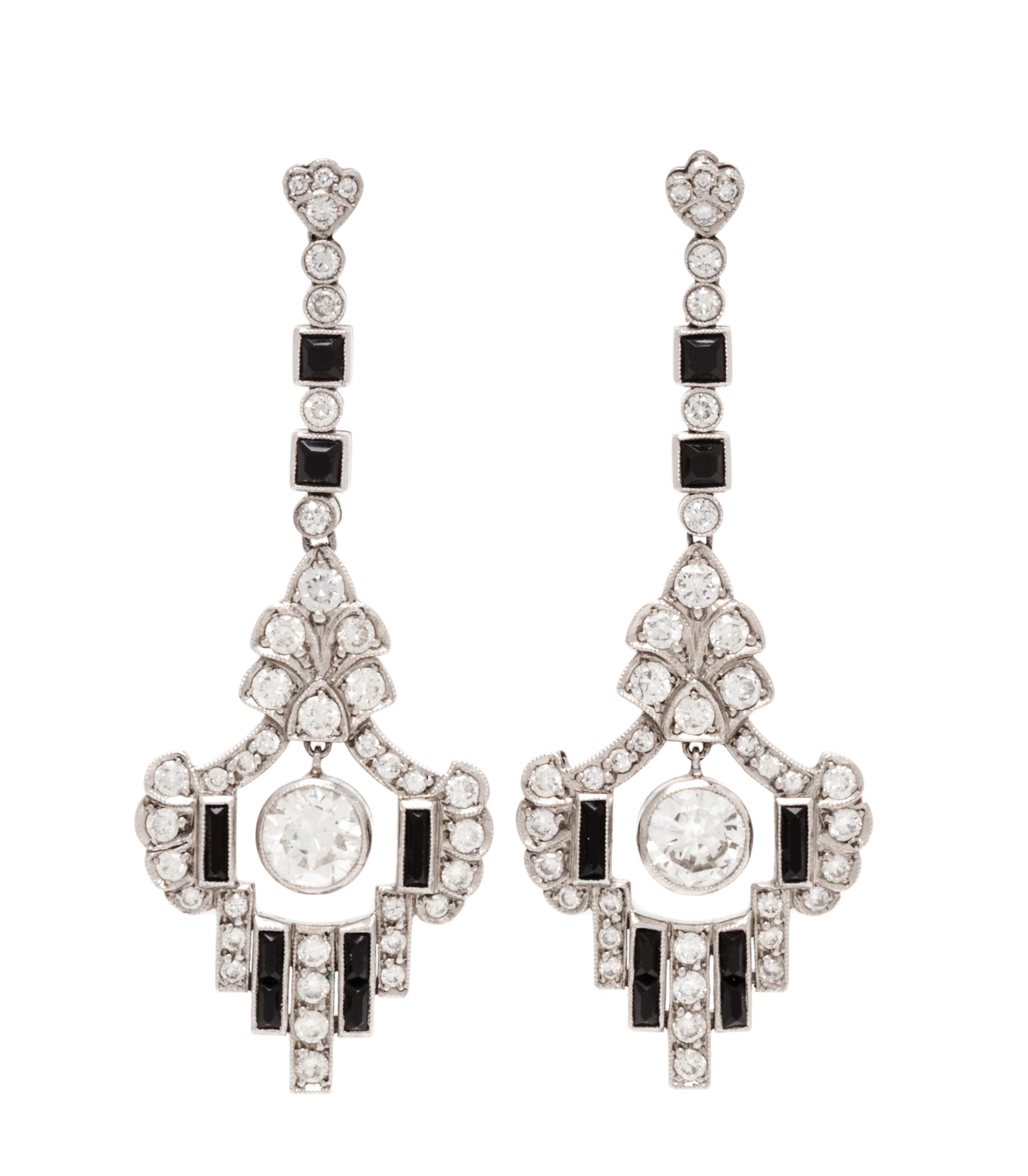 A Pair of Platinum, Diamond and Onyx Pendant Earrings, 7.00 dwts.