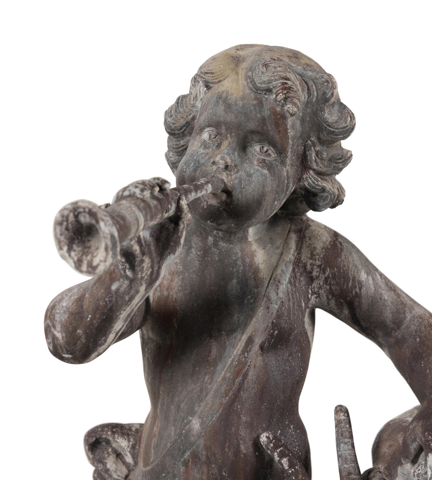 A Cast Lead Figural Group