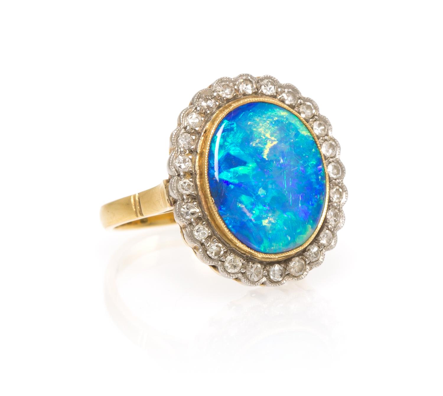 An 18 Karat Yellow Gold Opal Doublet and Diamond Ring, 3.90 dwts.