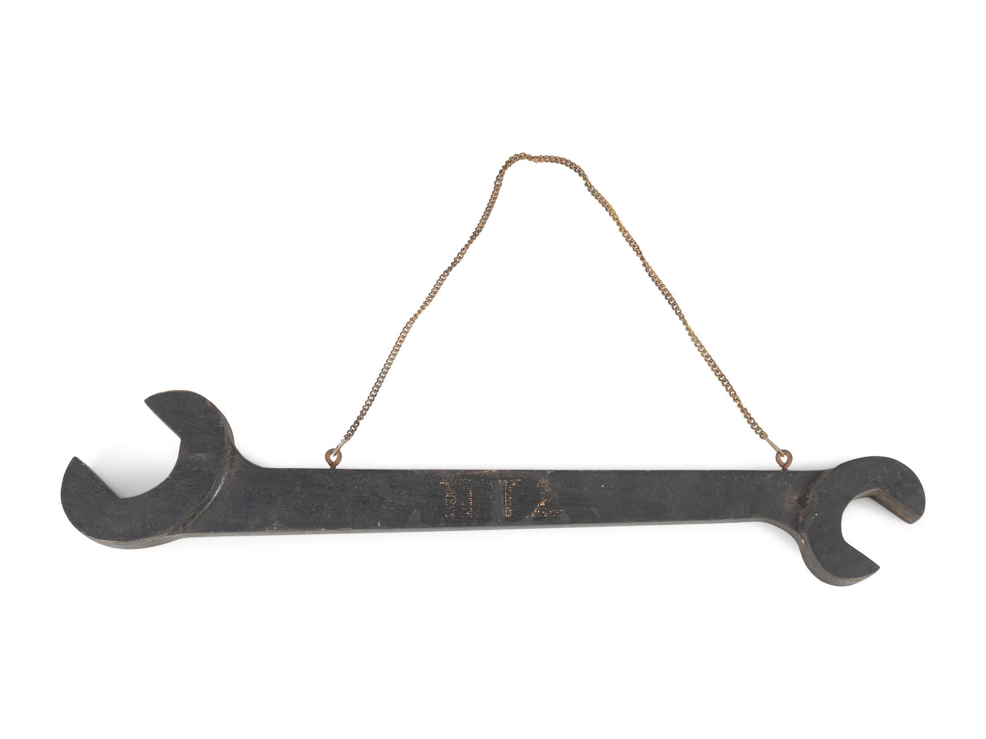 A Wrench-From Trade Sign and a Harness Maker Trade Sign