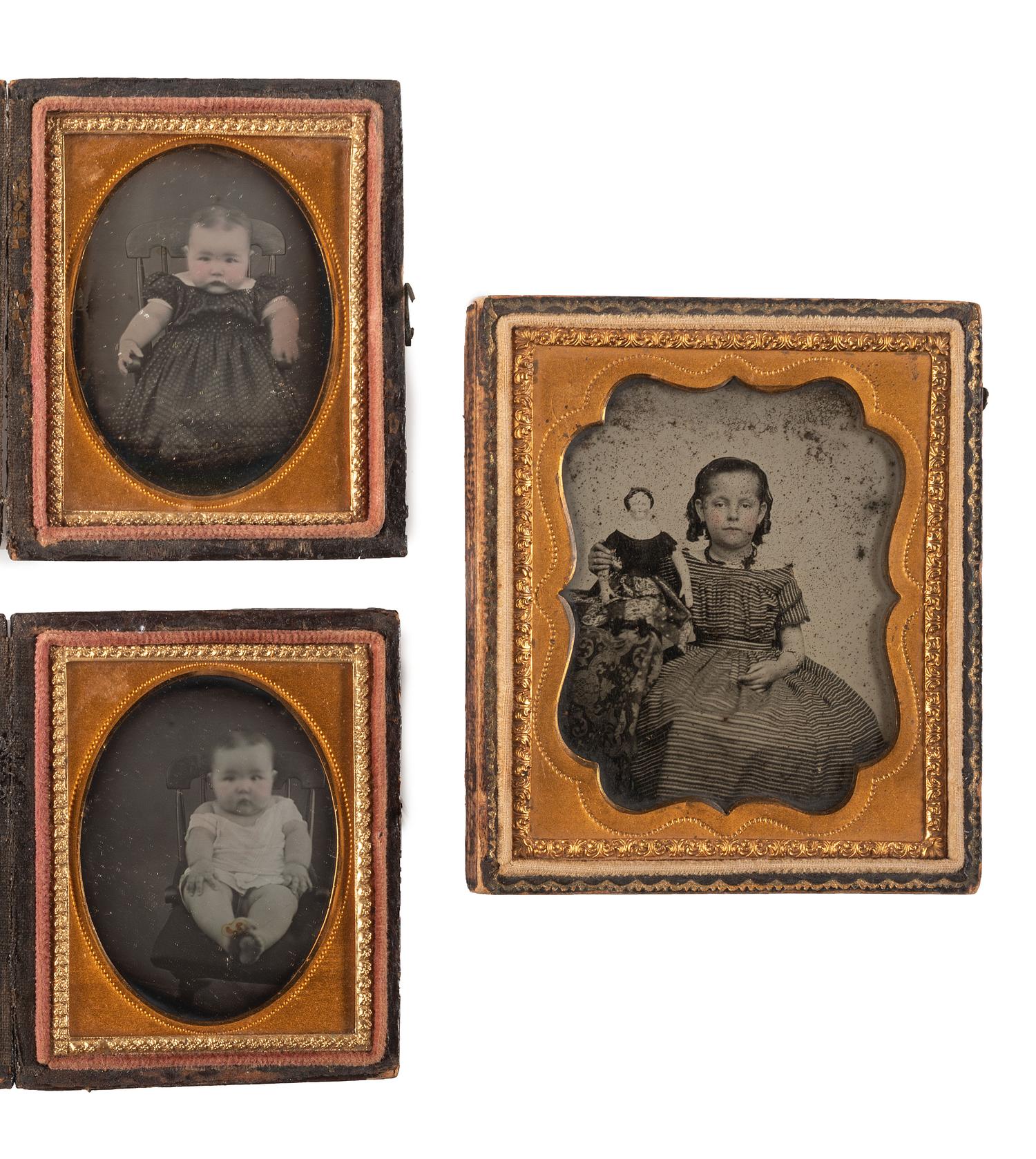 [EARLY PHOTOGRAPHY]. A group of 4 daguerreotype and ambrotype portraits of babies and children, highlighted by a fine daguerreotype featuring a mother and her child, comprising: