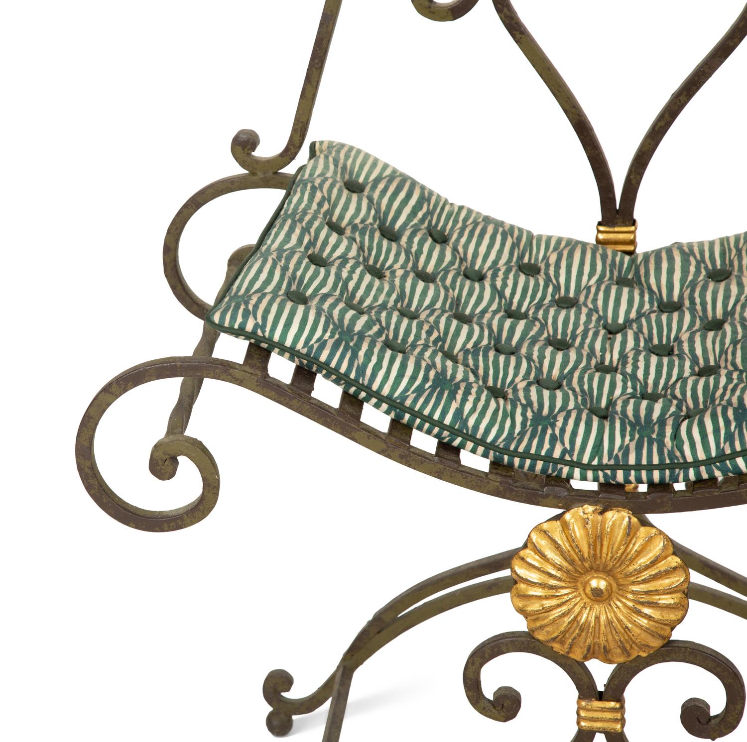 A Pair of Painted and Parcel Gilt Iron Curule Stools with Tufted Cushions