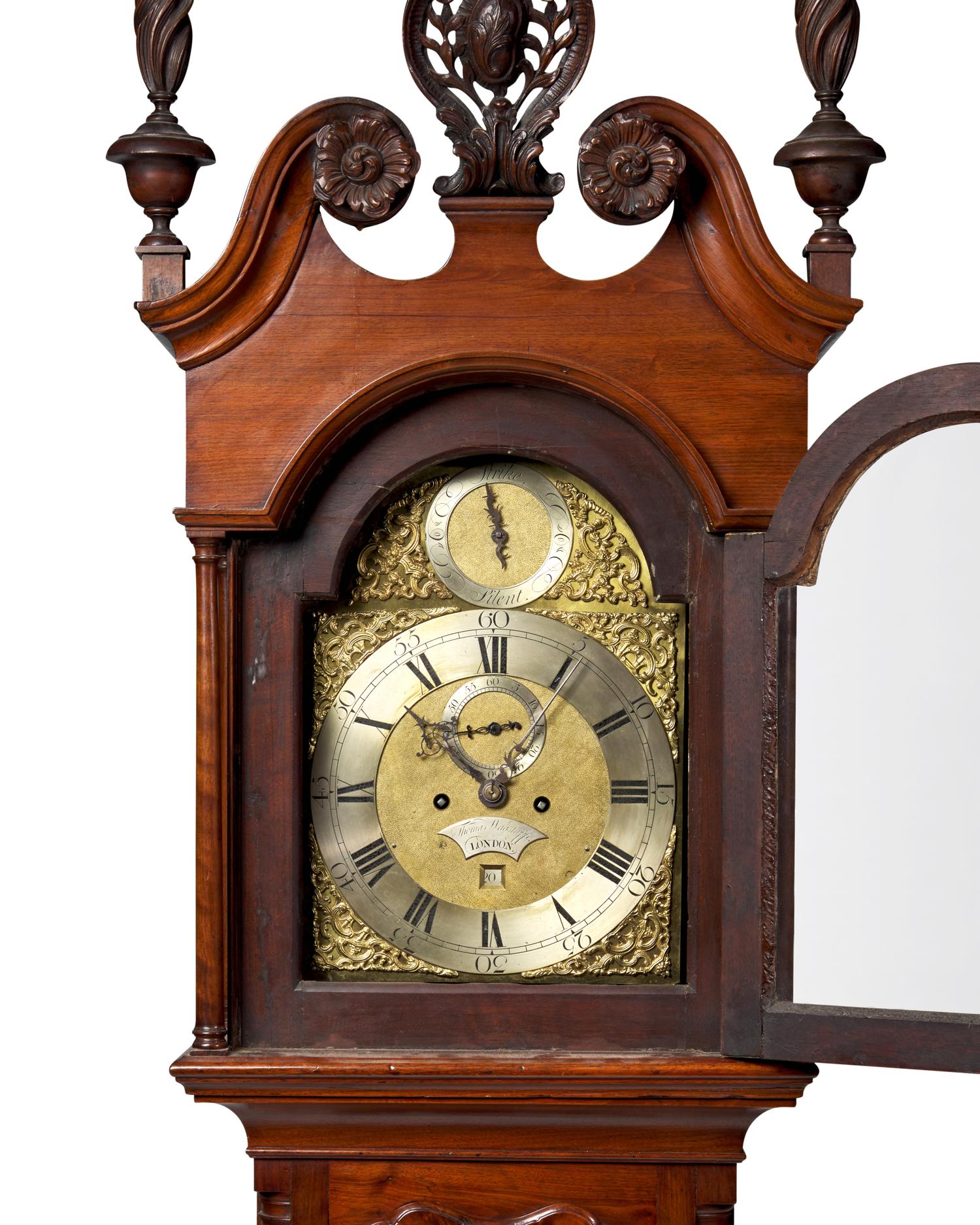 A Chippendale Carved and Figured Walnut Tall Case Clock