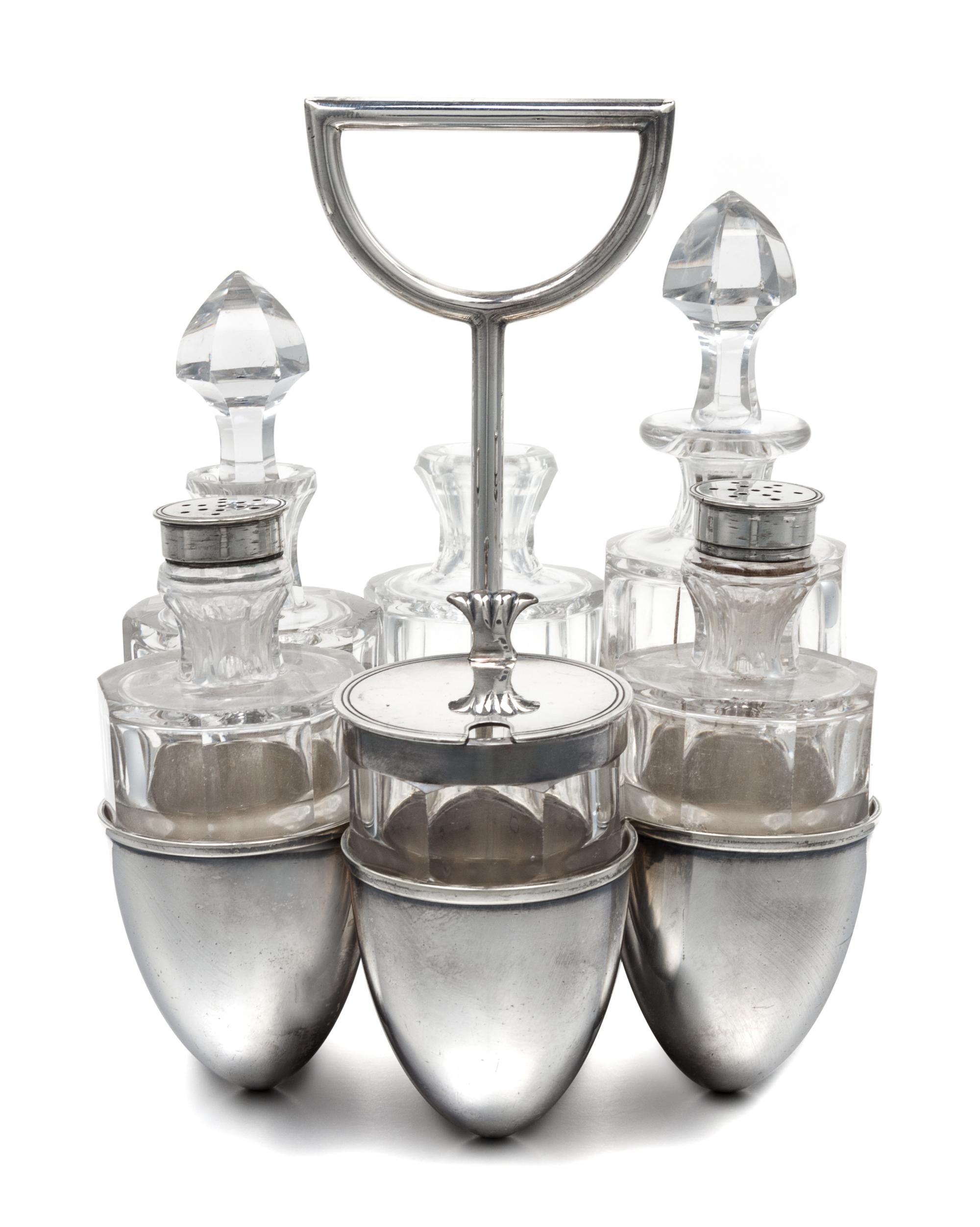 An English Silver-Plate Cruet Set, Dr. Christopher Dresser for Hukin & Heath, Birmingham, the caddy having six egg-form cups and a cent