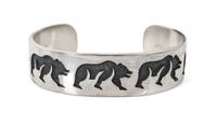 A Hopi Silver Overlay Bracelet, Ted Wadsworth Length 6 x opening 1 1/4 x width 3/4 inches.