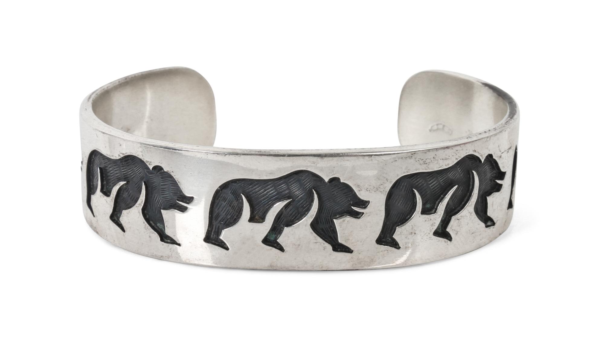 A Hopi Silver Overlay Bracelet, Ted Wadsworth Length 6 x opening 1 1/4 x width 3/4 inches.