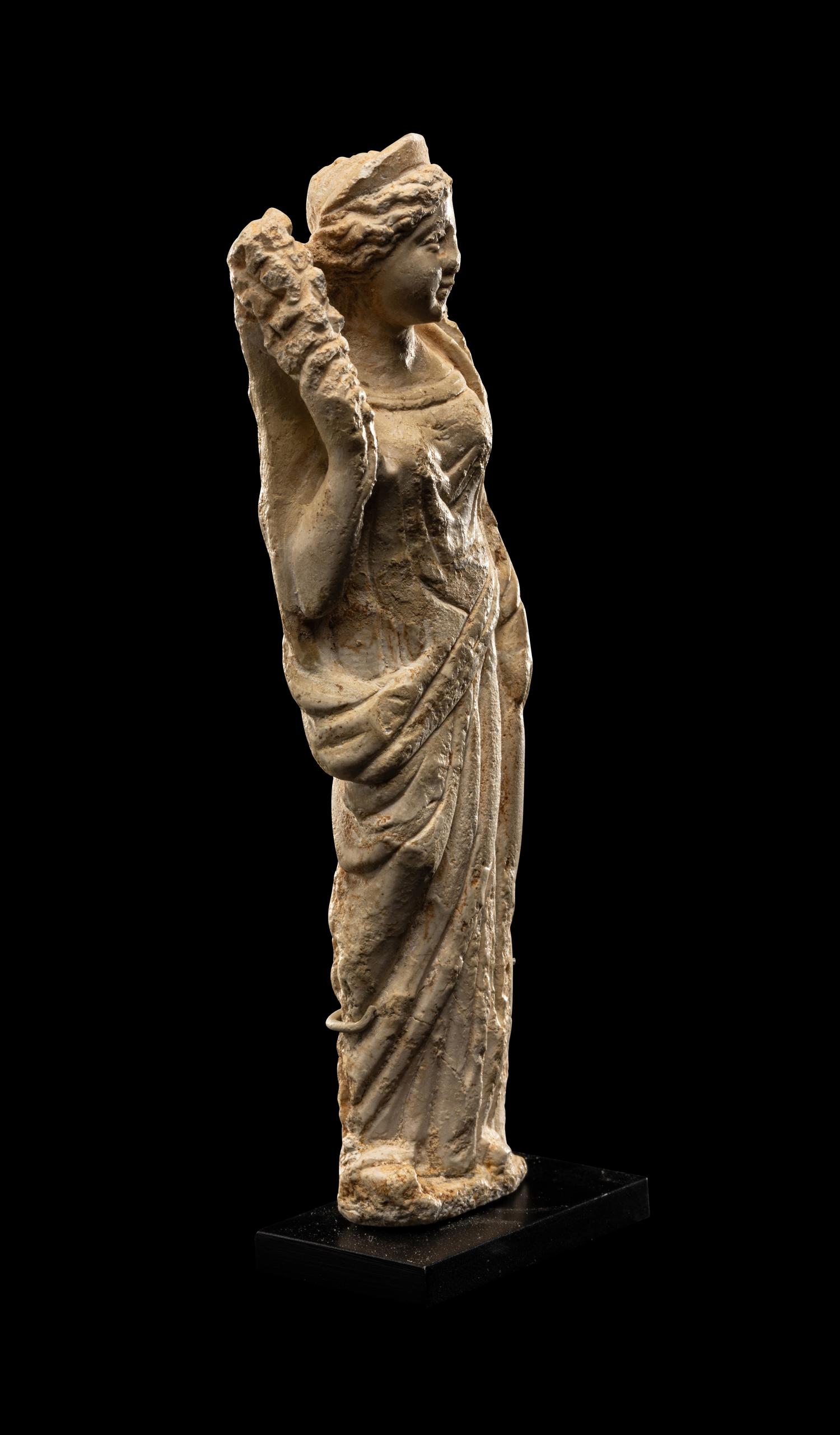 A Roman Stucco Figure of Fortuna