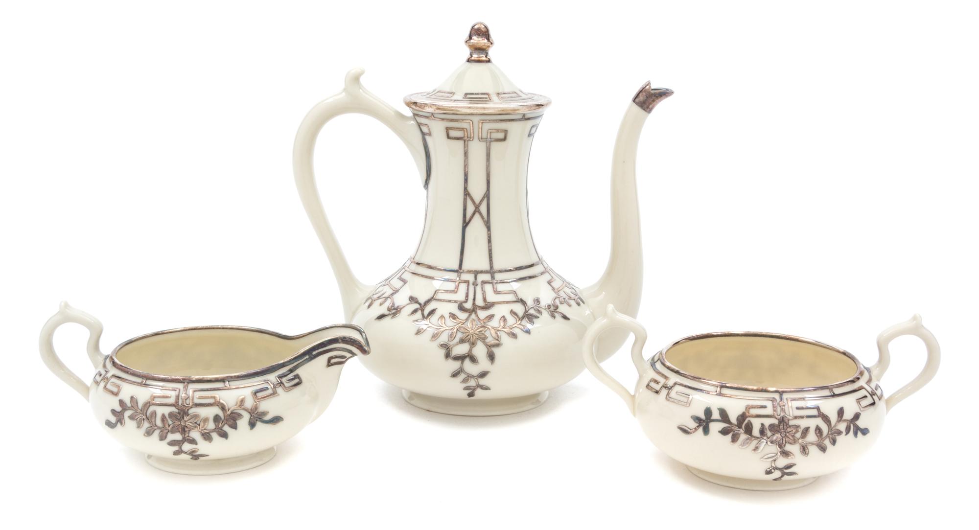 A Belleek Willets Porcelain Silver Overlay Coffee Service Height of coffee pot 6 1/2 inches.