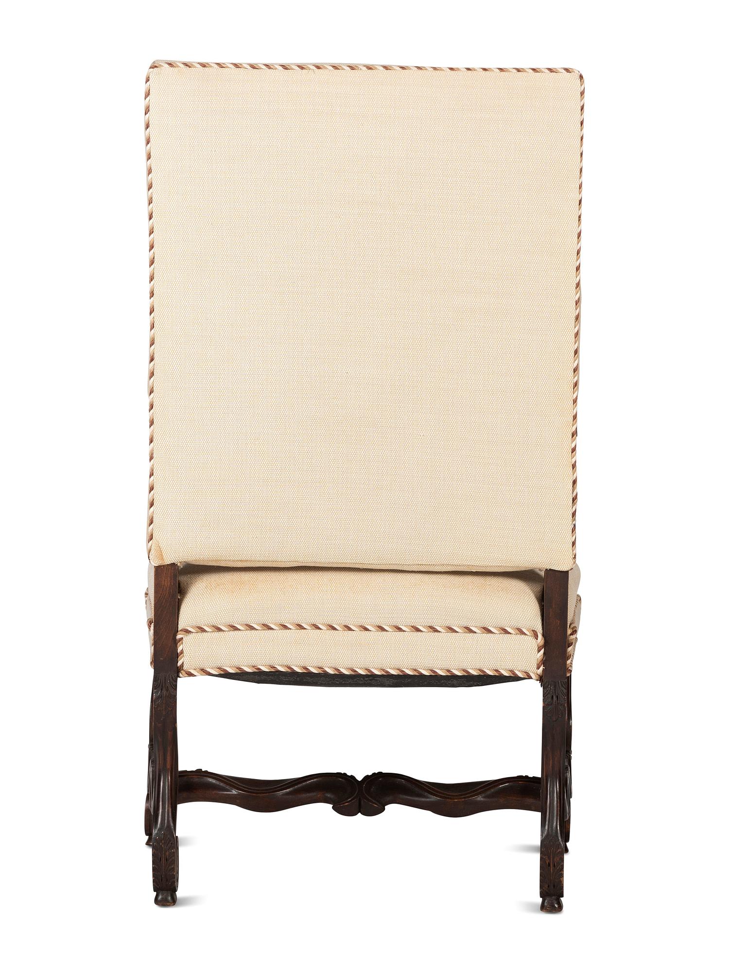 A Louis XIV Style Foliate and Scroll Carved Walnut Upholstered Fauteuil