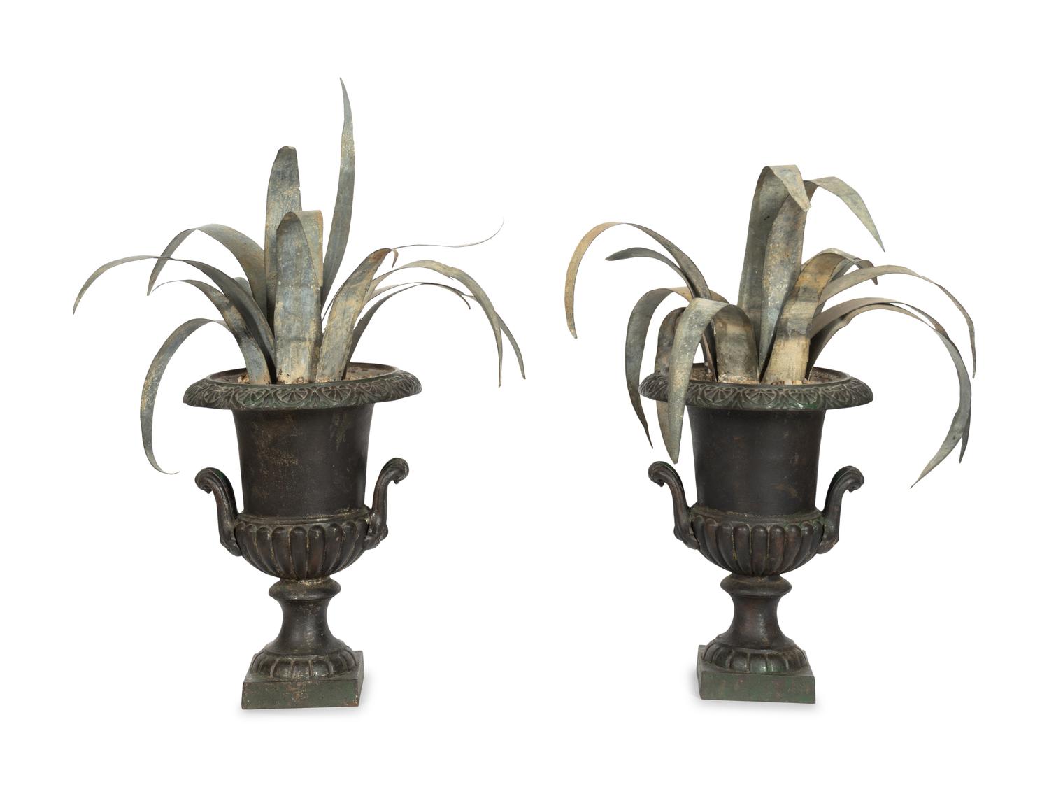 A Pair Cast Iron Urns with Tole Palm Topiaries