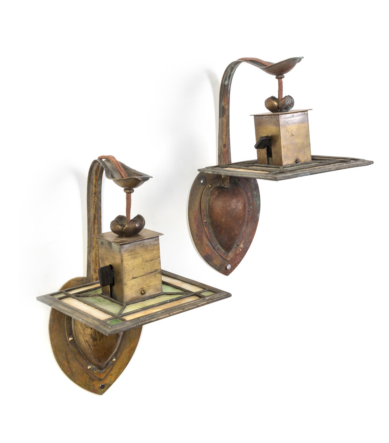 Attributed to Stickley Brothers Co., Grand Rapids, Michigan, a pair of sconces