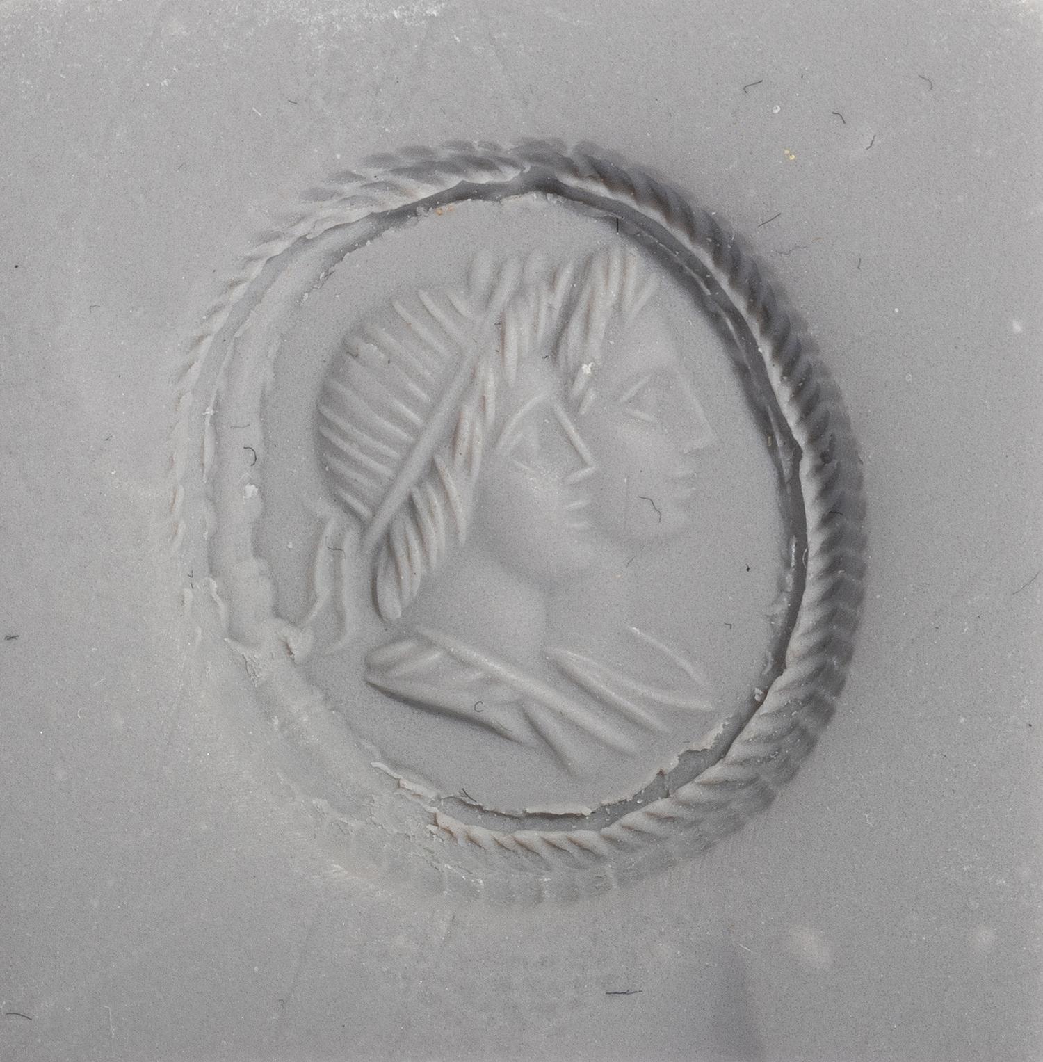 A Neoclassical Sardonyx Cameo and Gold Finger Ring with a Double Portrait