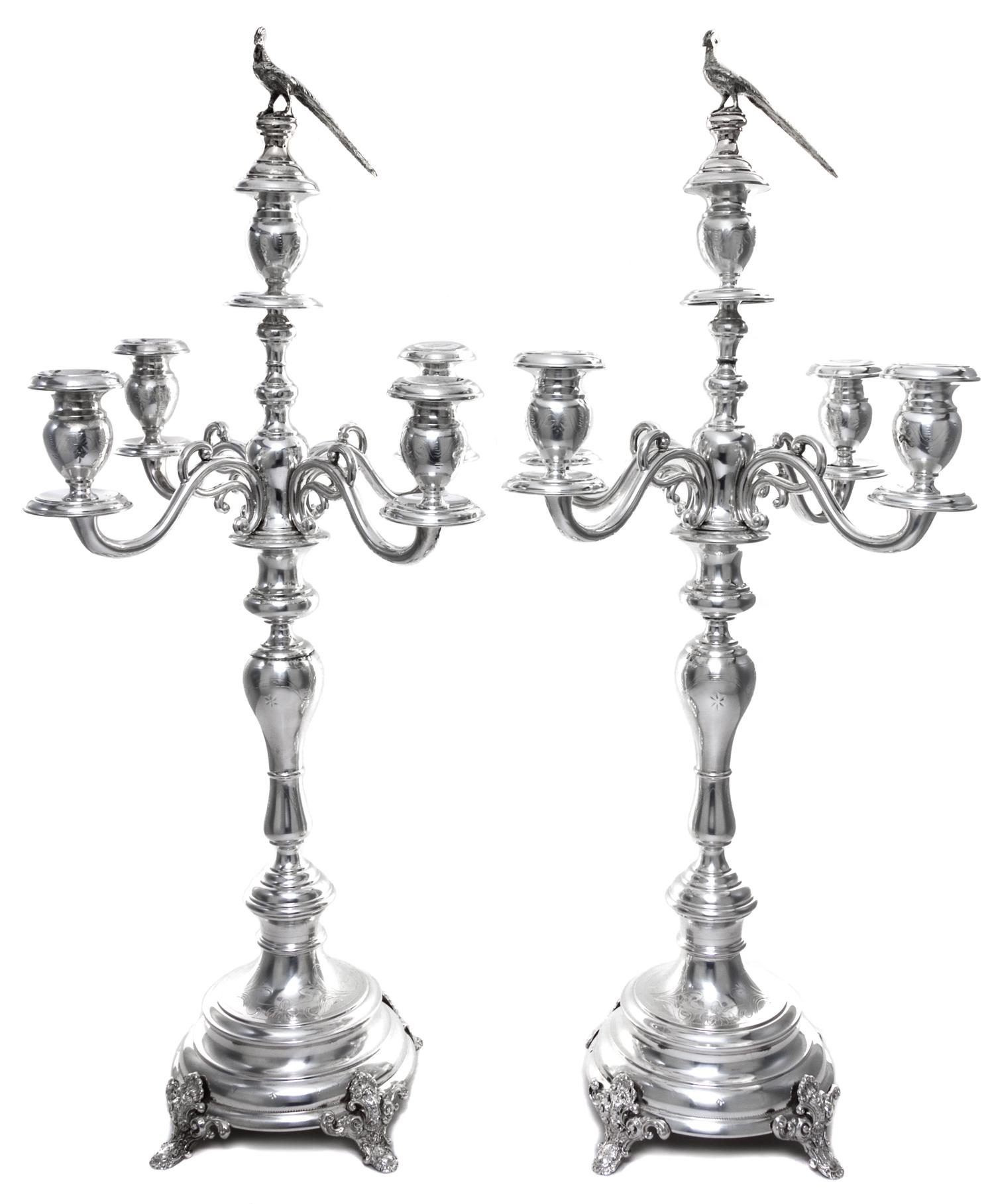A Pair of Austrian Silver Five-Light Candelabra, Maker's Mark S (pellet) H, Vienna, Late 19th/Early 20th Century, having a central urn