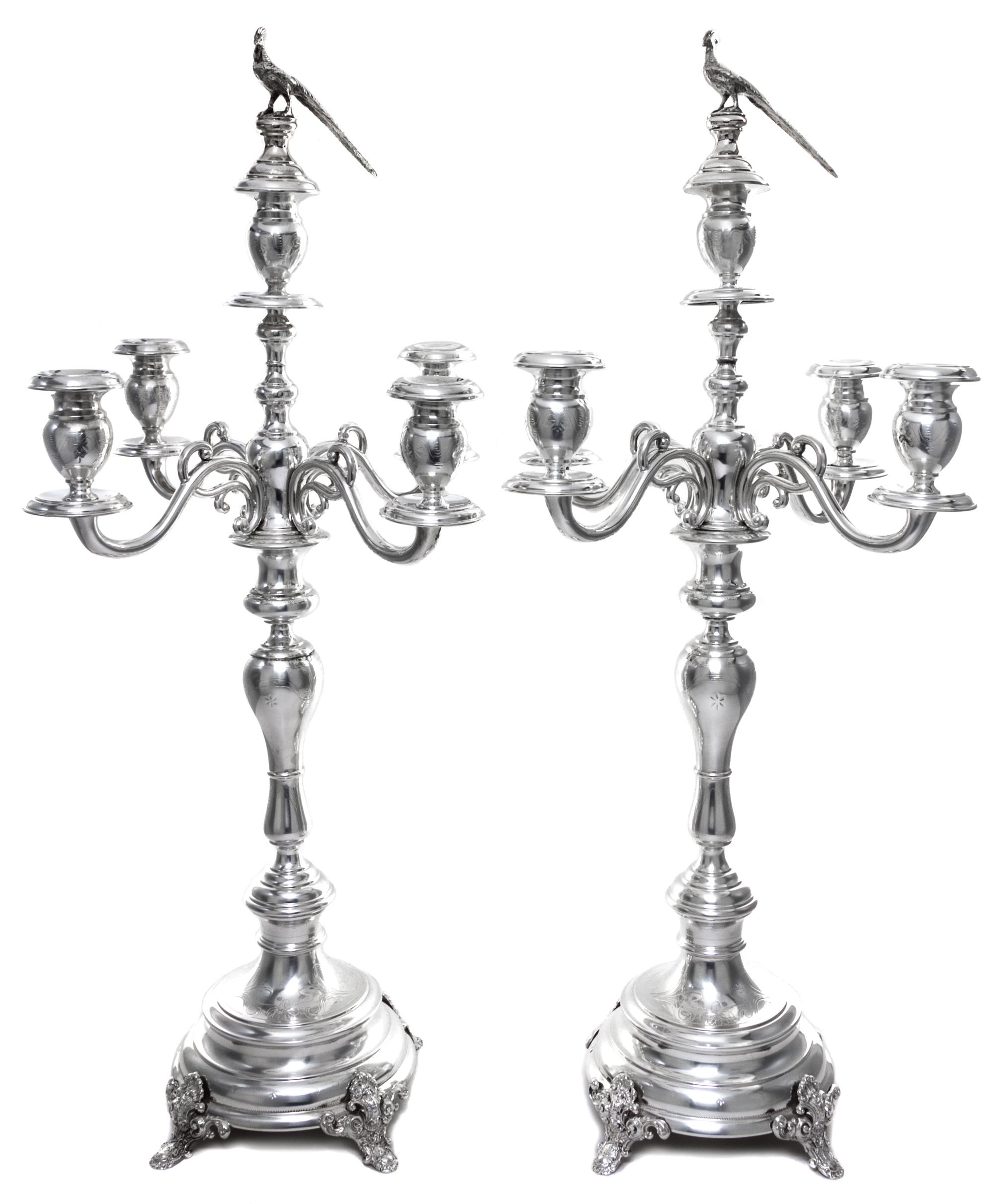 A Pair of Austrian Silver Five-Light Candelabra, Maker's Mark S (pellet) H, Vienna, Late 19th/Early 20th Century, having a central urn