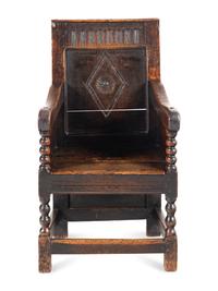A Charles II Oak Armchair