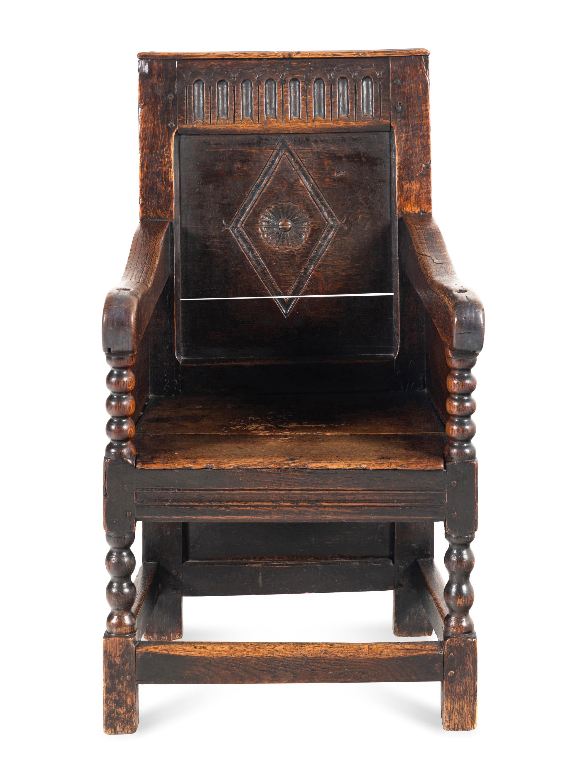 A Charles II Oak Armchair