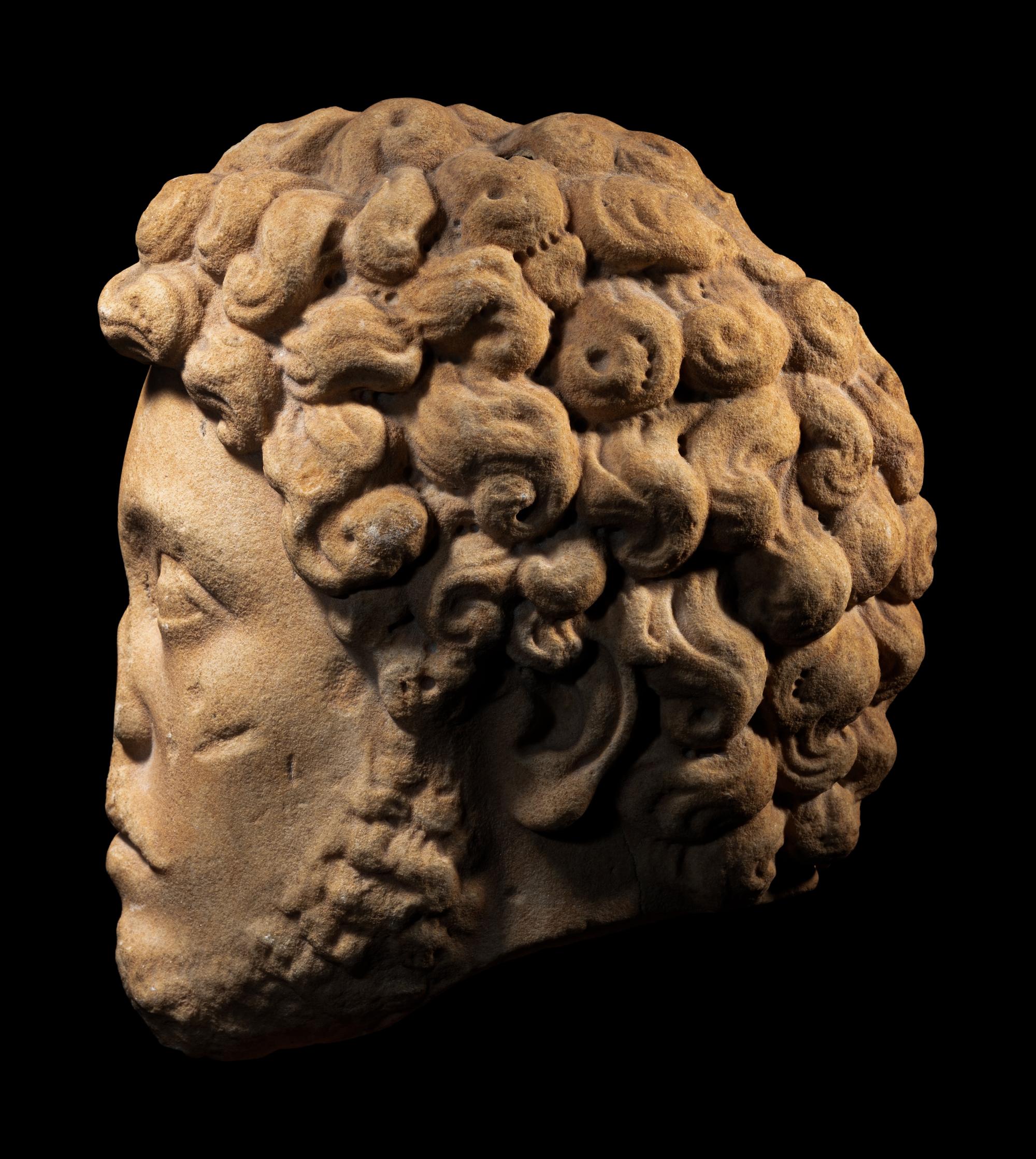A Roman Marble Portrait Head of Marcus Aurelius from a Relief