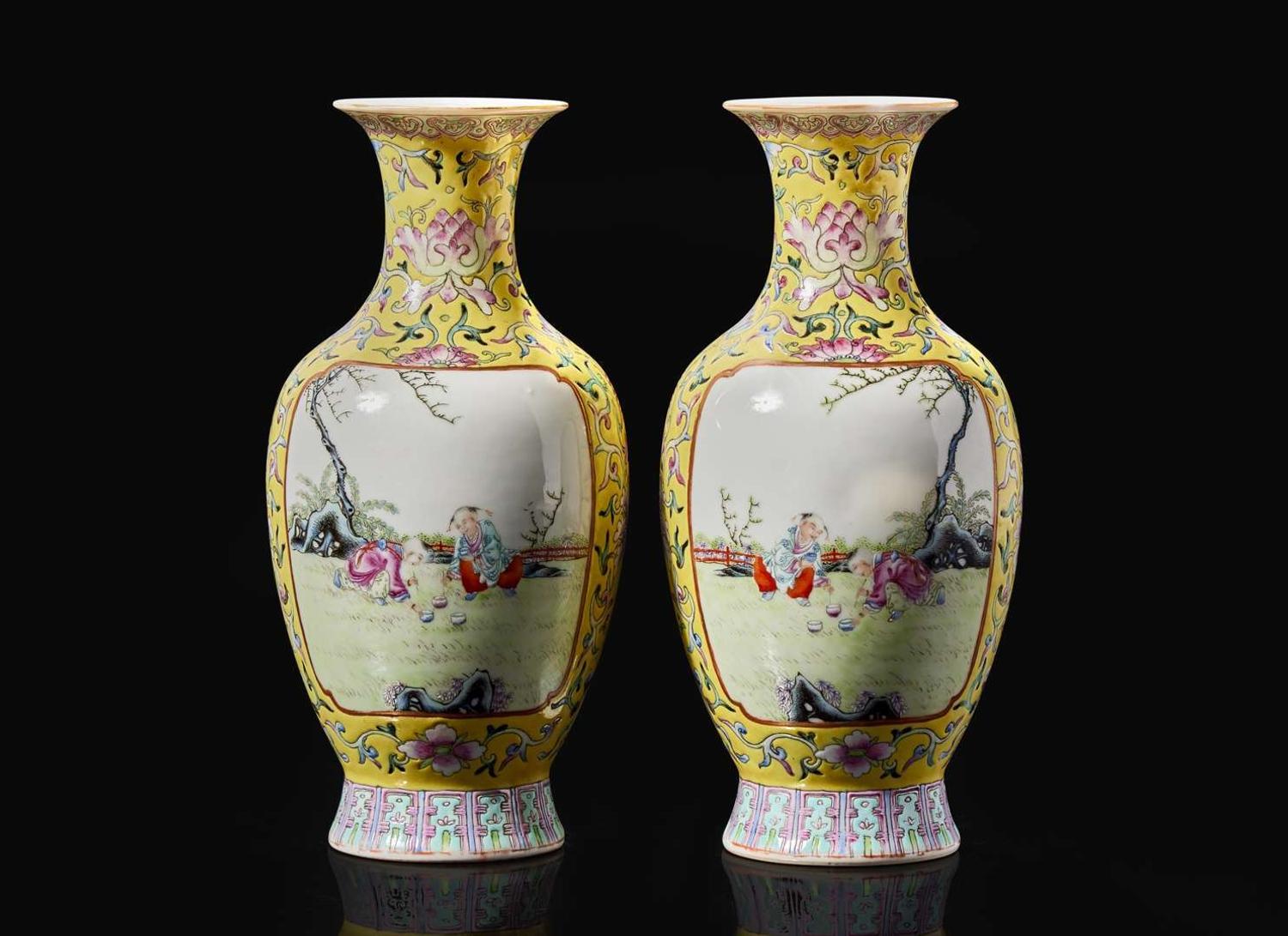 A pair of Chinese famille rose decorated yellow-ground “Boys” vases, 20th Century 黃地粉彩嬰戲盌一對 二十世紀