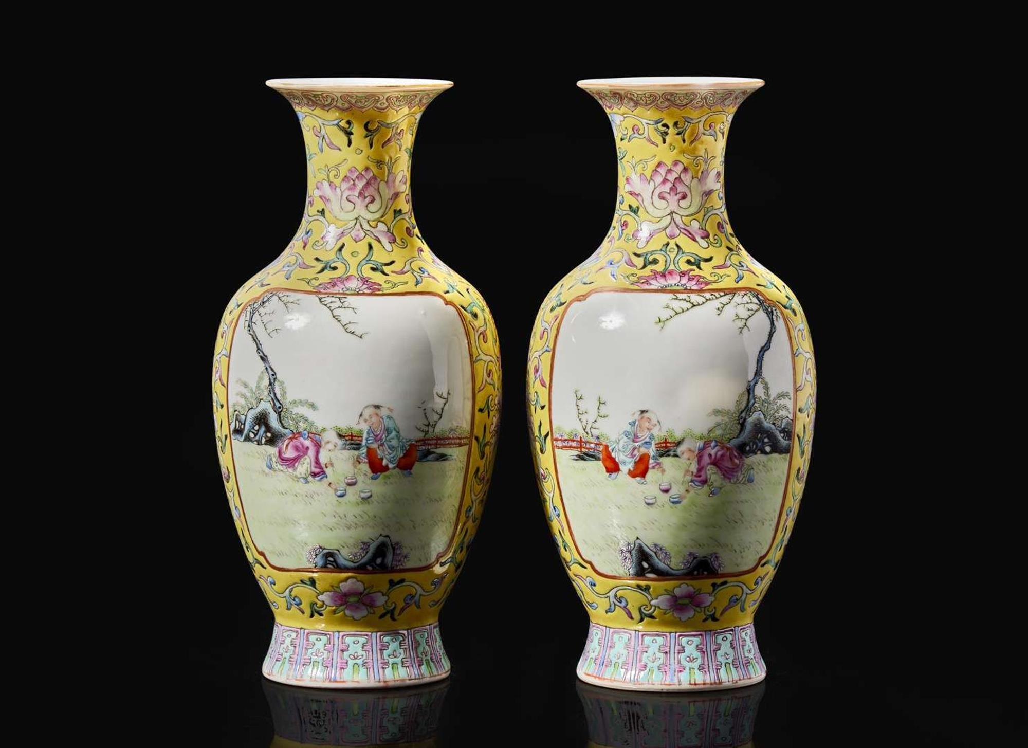 A pair of Chinese famille rose decorated yellow-ground “Boys” vases, 20th Century 黃地粉彩嬰戲盌一對 二十世紀