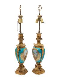 A Pair of Sèvres Style Gilt Bronze Mounted "Jeweled" Porcelain Fluid Lamps