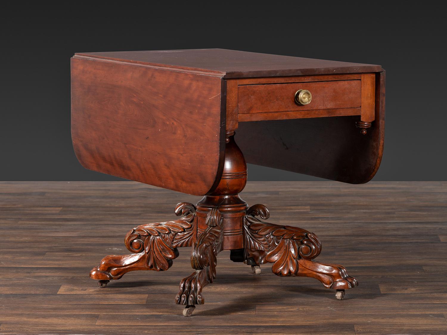 A Classical Highly Carved Cherrywood Drop-Leaf Dining Table