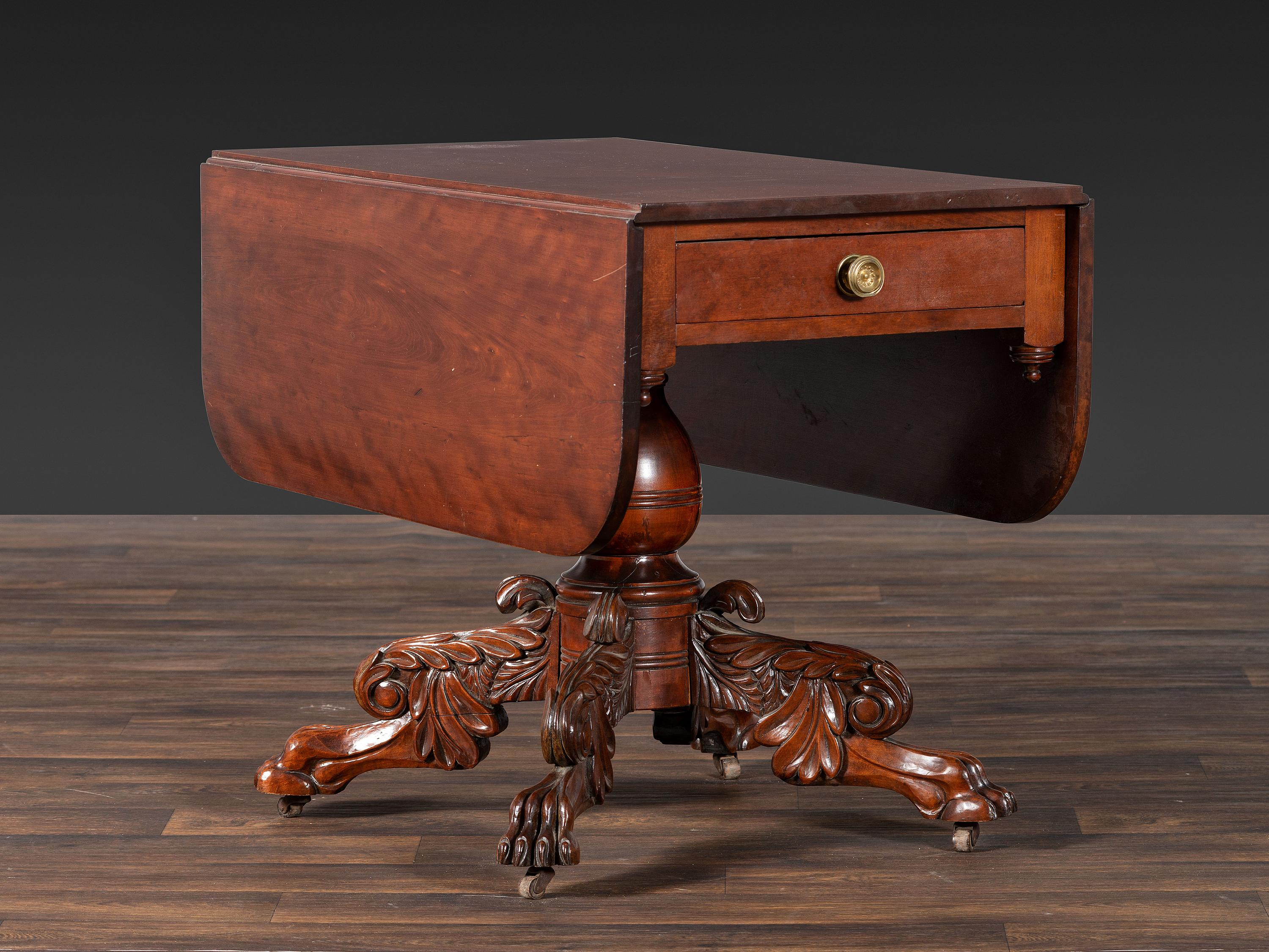 A Classical Highly Carved Cherrywood Drop-Leaf Dining Table