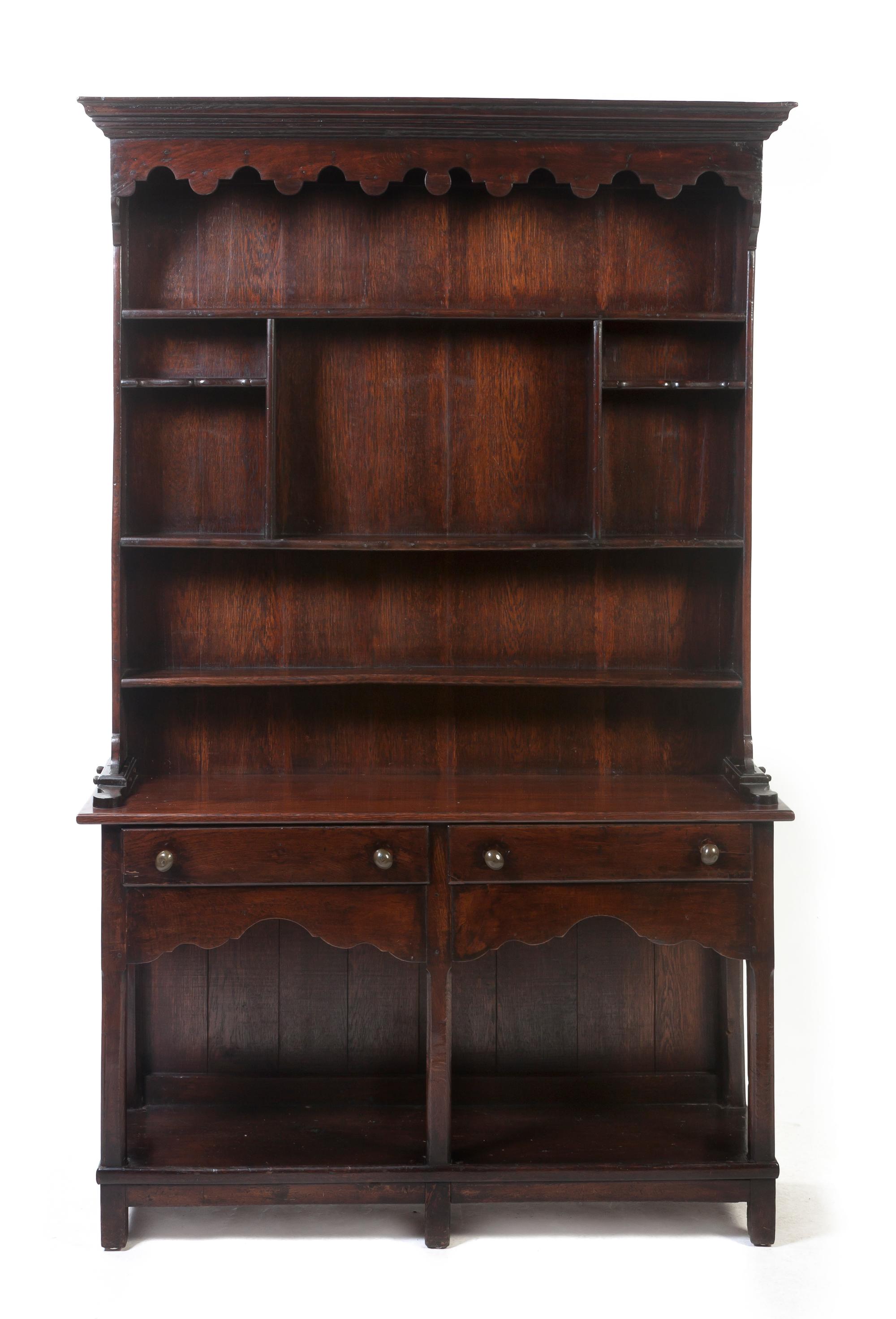 An Oak Welsh Dresser, Height 75 x width 47 1/2 x depth 13 1/2 inches.