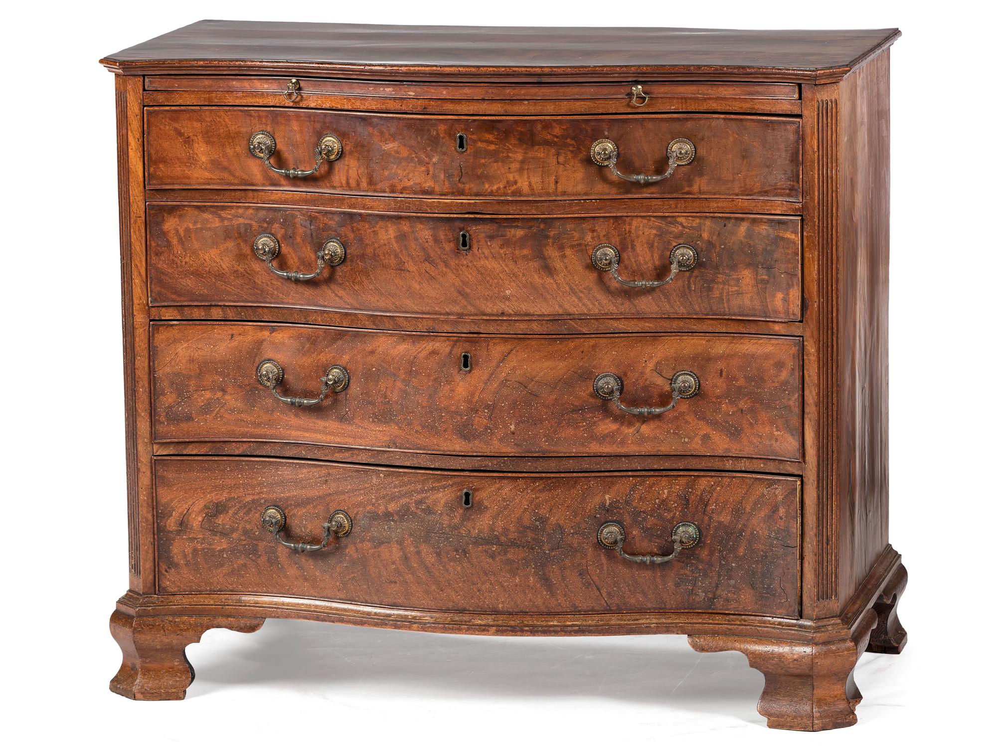 A George III Figured Mahogany Serpentine Front Bachelor's Chest