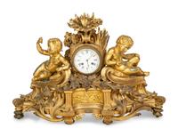A Napoleon III Gilt Bronze Mantel Clock