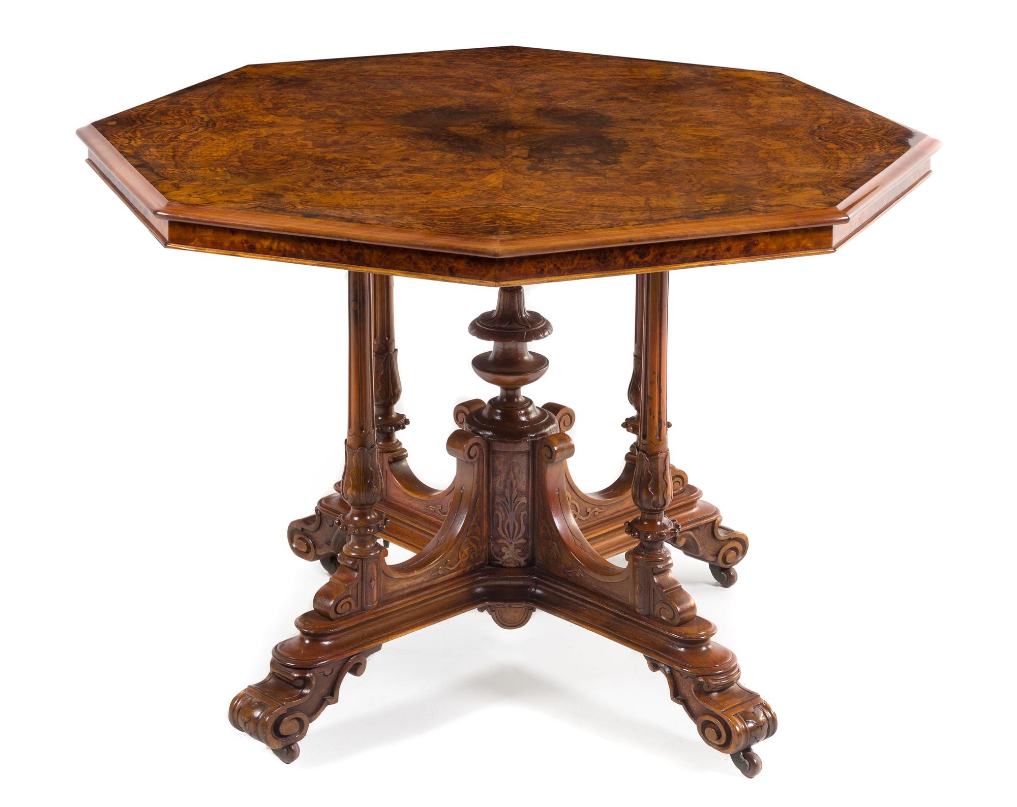 A Victorian Burlwood Center Table Height 28 1/2 x width 41 1/2 inches. — THIRD QUARTER 19TH CENTURY
