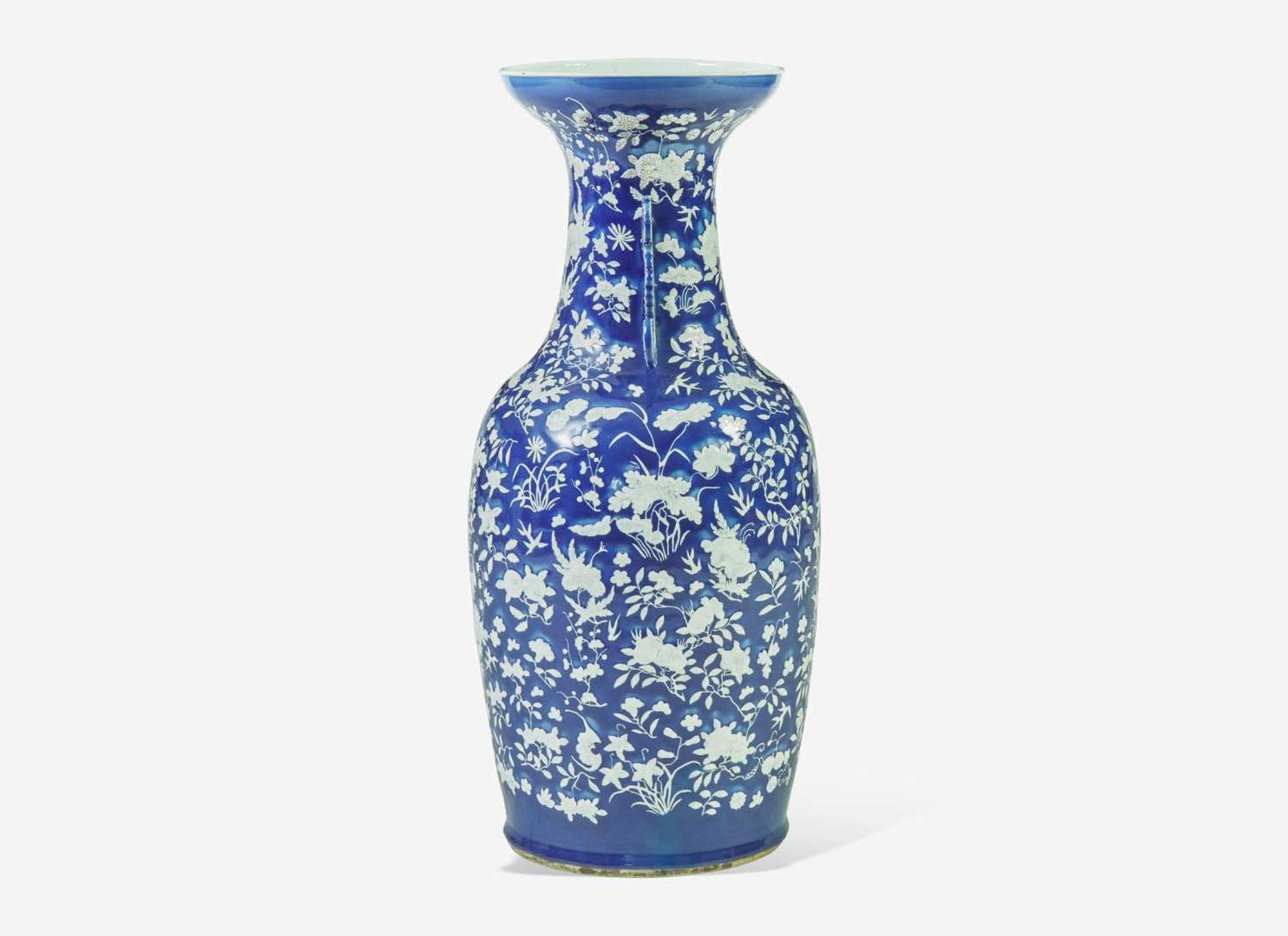 A very large Chinese blue ground white slip-decorated vase, mid 19th century 藍地白花貫耳瓶 十九世紀