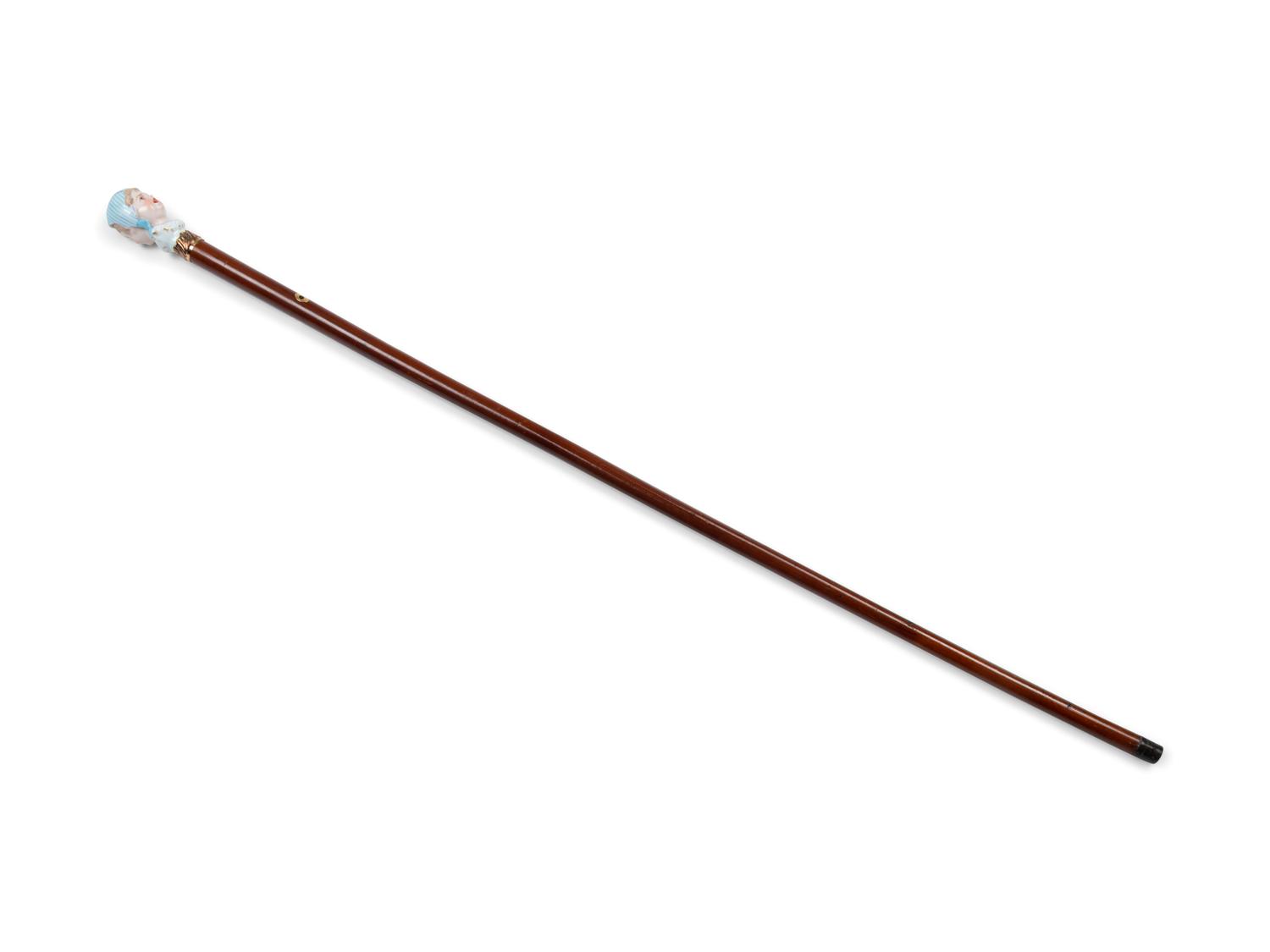 A French Figural Porcelain and Gilt Metal Mounted Cane
