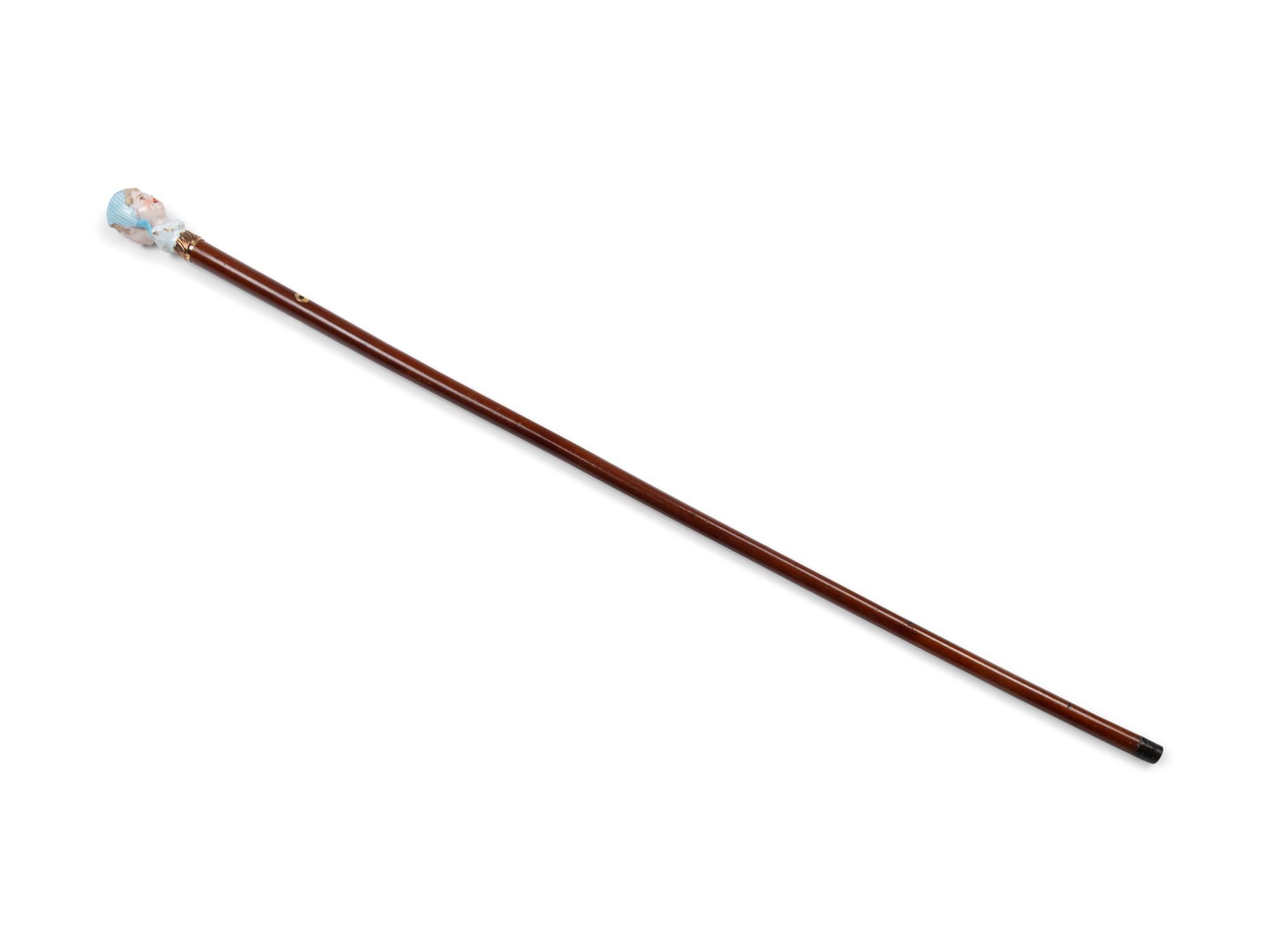 A French Figural Porcelain and Gilt Metal Mounted Cane