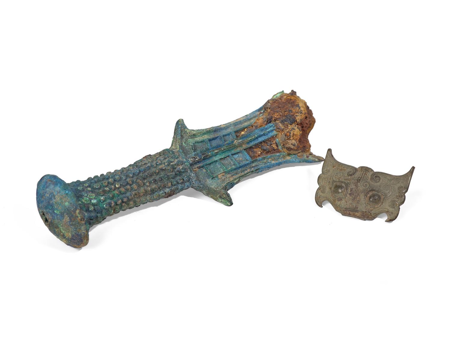 A Chinese Bronze Beast Mask and A Bronze Sword Hilt