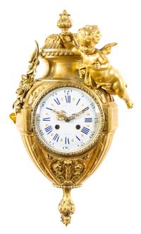 A French Gilt Bronze Cartel Clock Height 22 inches. — RAINGO FRERES