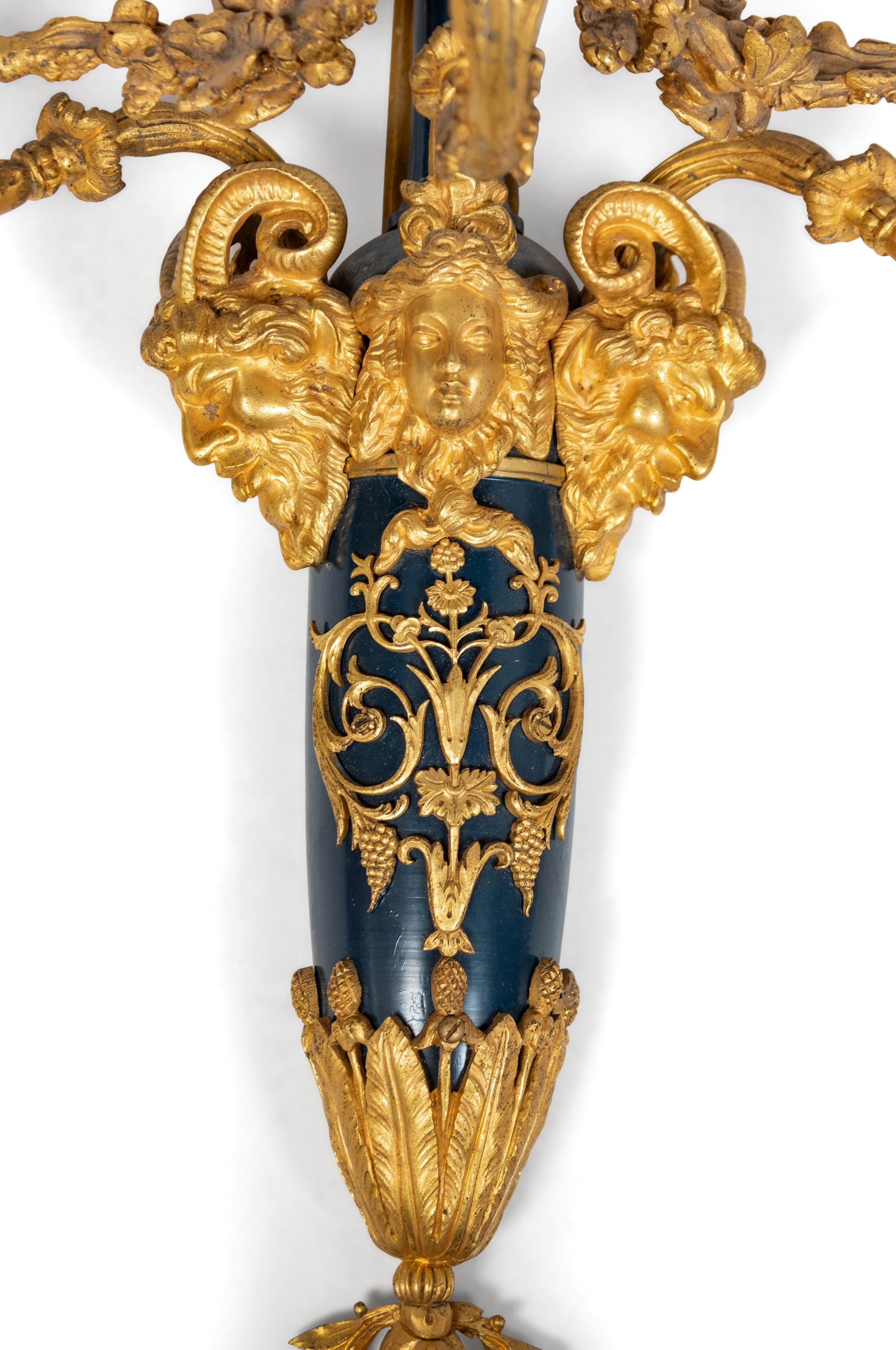 A Pair of Louis XVI Style Part Ebonized and Gilt-Bronze Three-Light Sconces