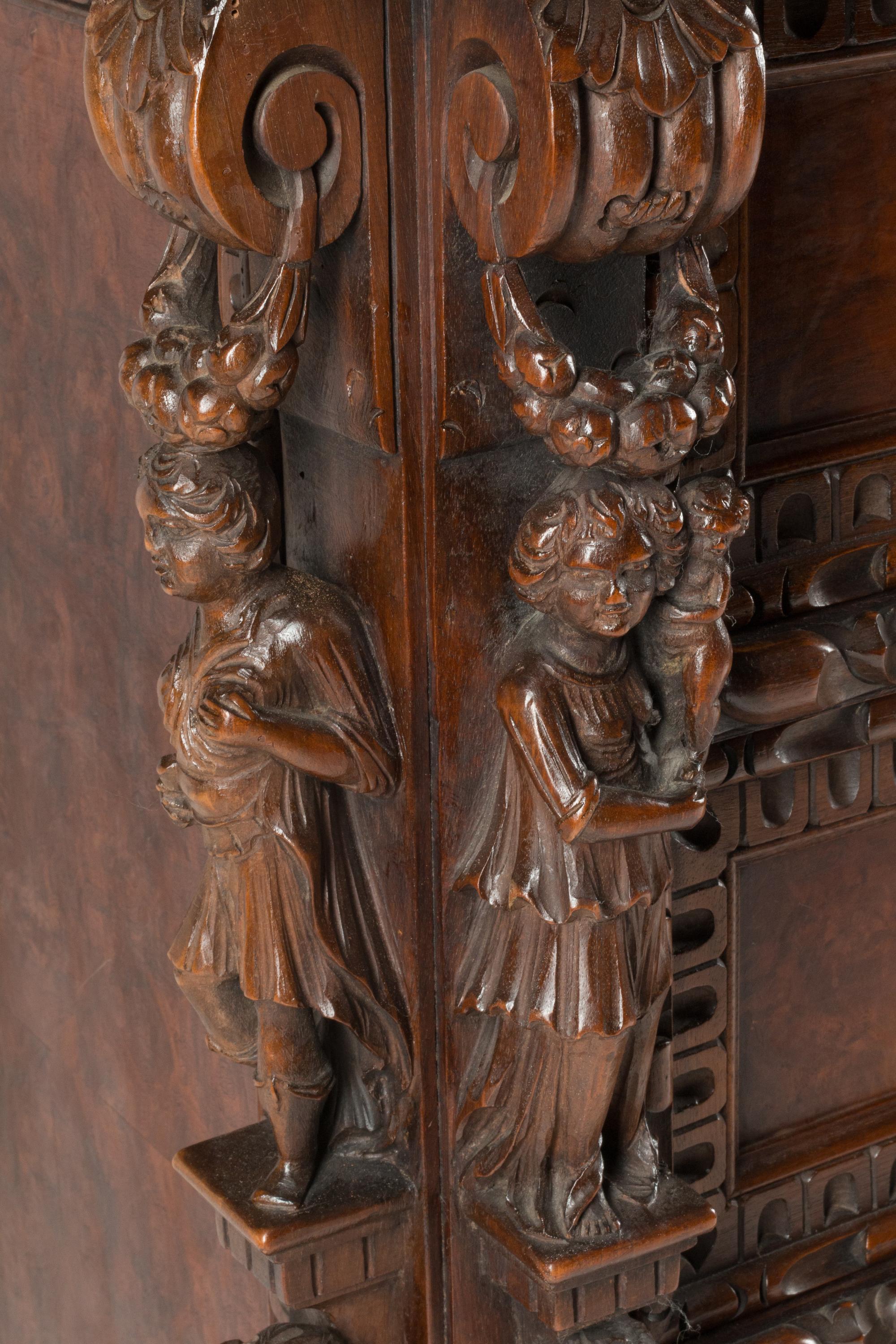 An Italian Renaissance Revival Carved Walnut Chest of Drawers