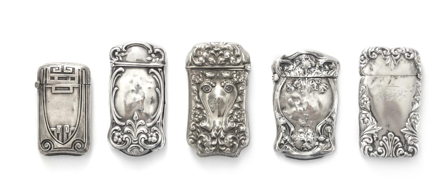 Five American Silver Vesta Cases, Various Makers, each of shaped rectangular form, comprising four examples with floral and foliate rep