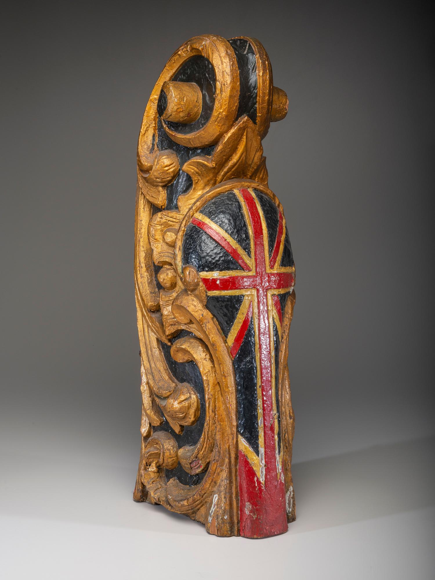 A Carved and Parcel Gilt Union Jack Mast Head