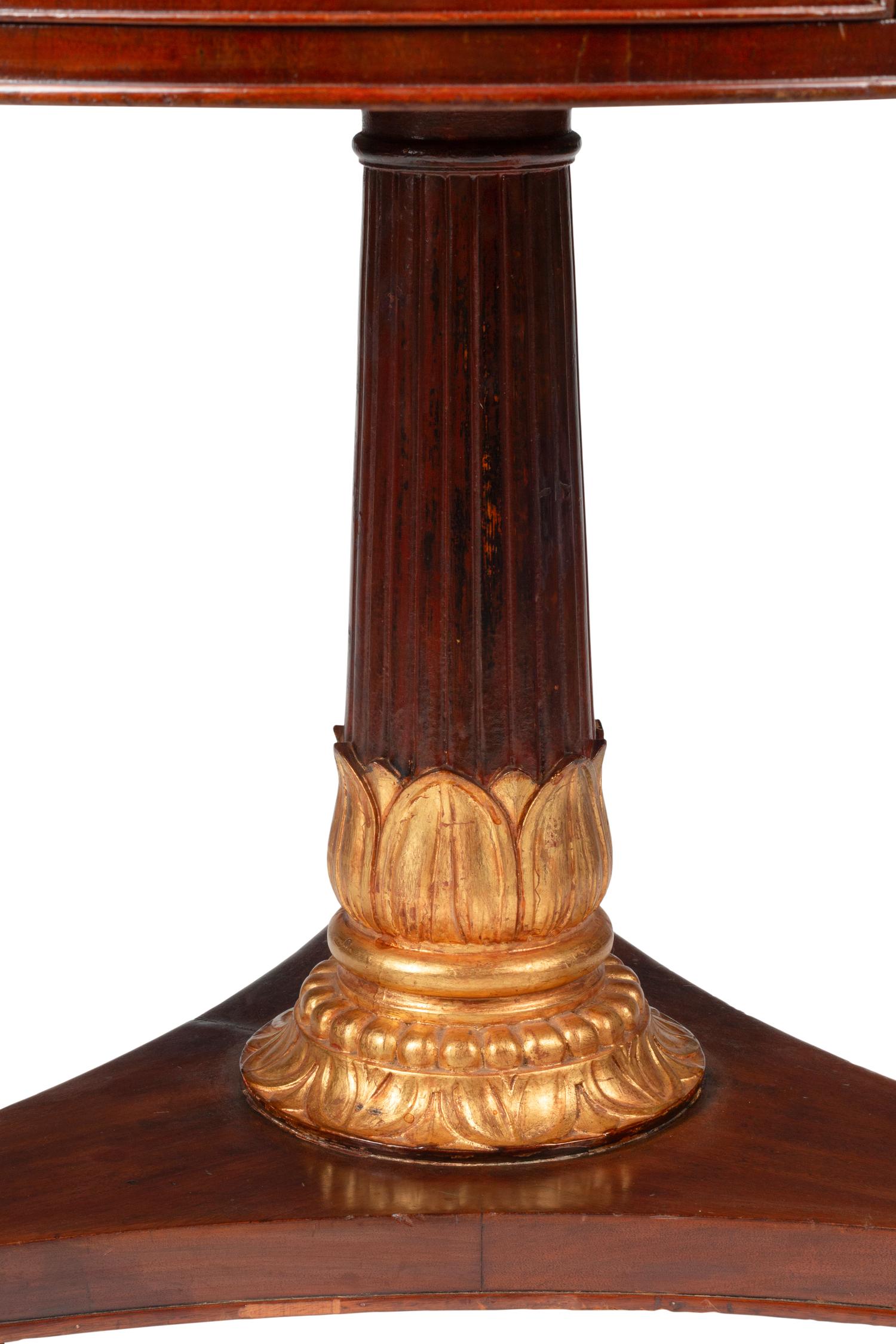 A Victorian Mahogany and Parcel Gilt "Rent" Table