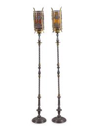 A Pair of Iron and Brass Floor Lamps