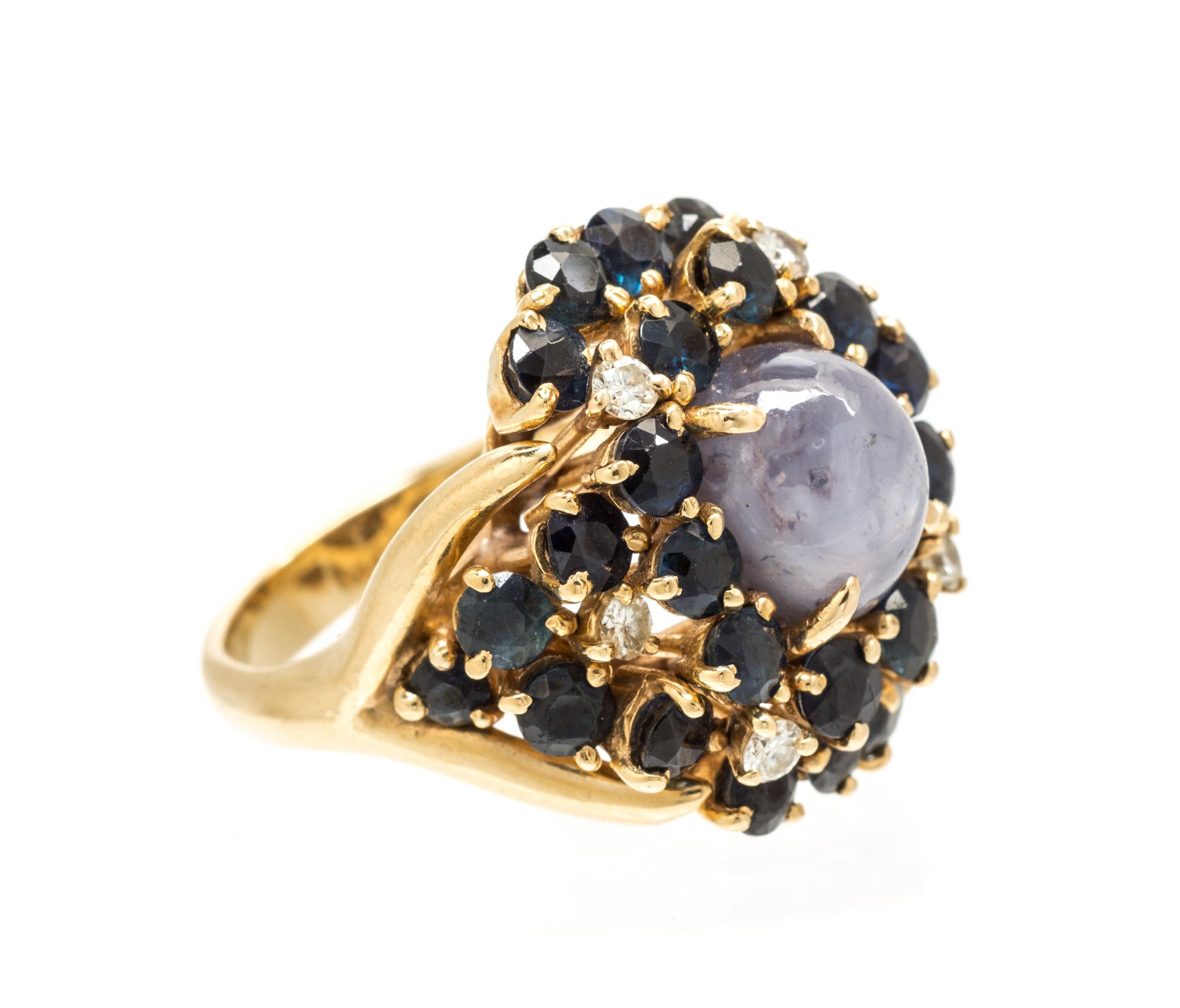 A 14 Karat Yellow Gold, Star Sapphire, Sapphire and Diamond Ring, 10.10 dwts.