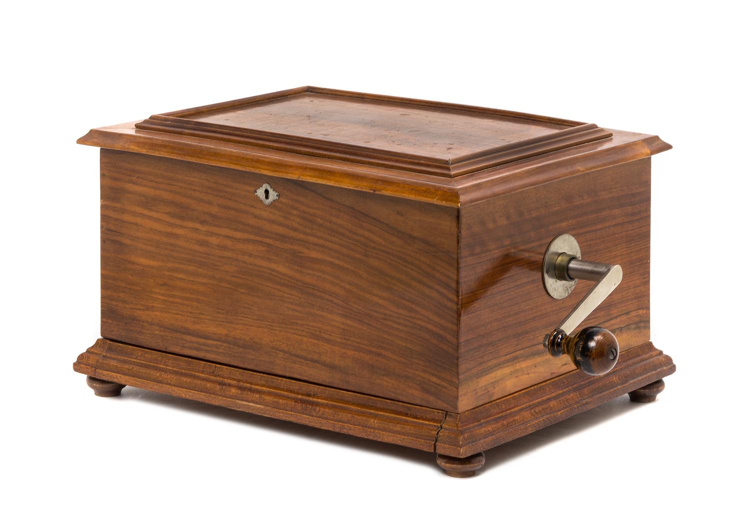A Swiss Walnut Disk Music Box, STELLA, Height 9 1/2 x width 16 1/2 x depth 11 3/4 inches. — STELLA,