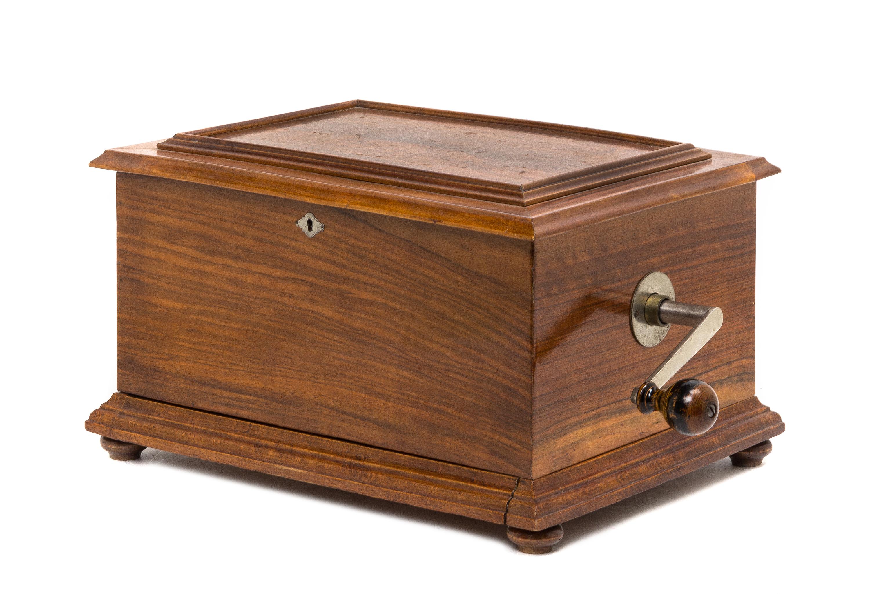 A Swiss Walnut Disk Music Box, STELLA, Height 9 1/2 x width 16 1/2 x depth 11 3/4 inches. — STELLA,