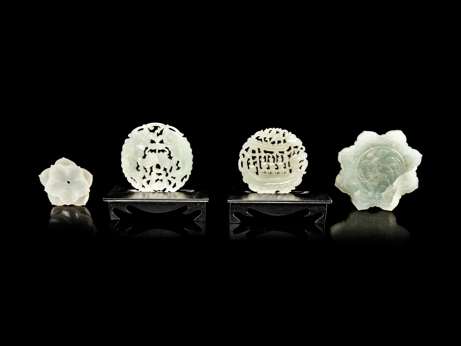 Four Reticulated Celadon Jade Pendants