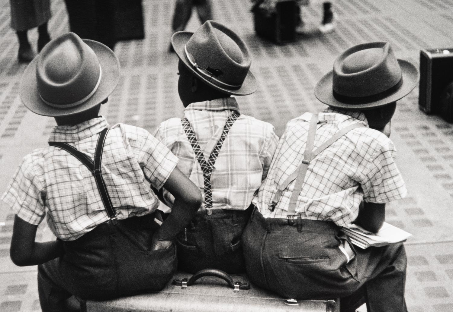 Ruth Orkin (1921-1985) Three Boys on a Suitcase, Penn Station, New York City, 1947