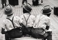Ruth Orkin (1921-1985) Three Boys on a Suitcase, Penn Station, New York City, 1947
