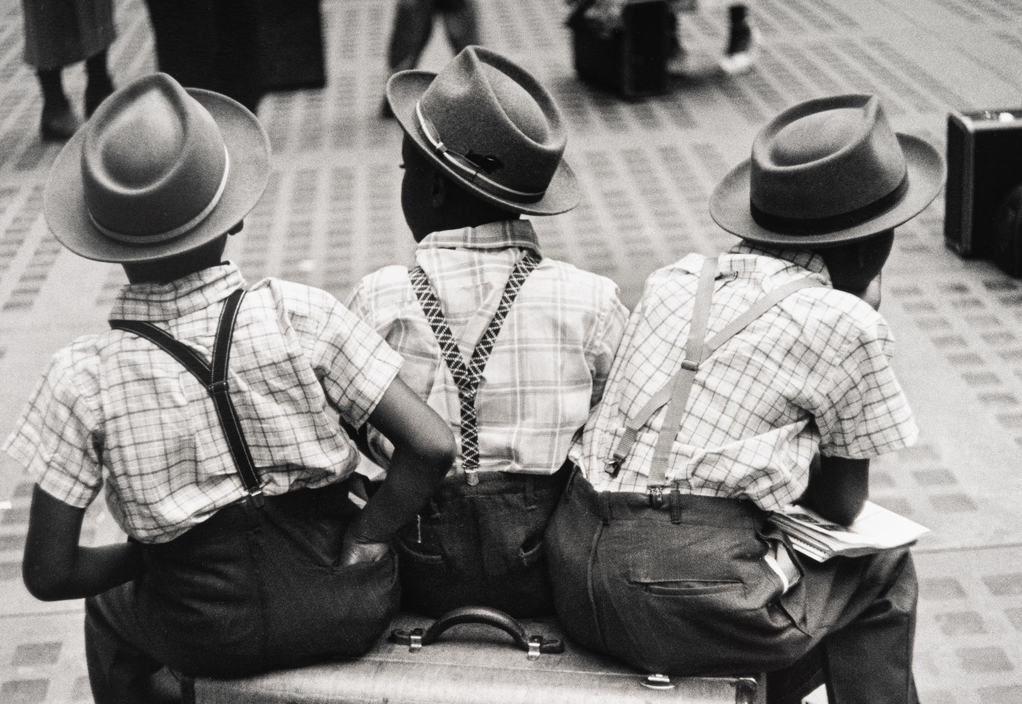 Ruth Orkin (1921-1985) Three Boys on a Suitcase, Penn Station, New York City, 1947