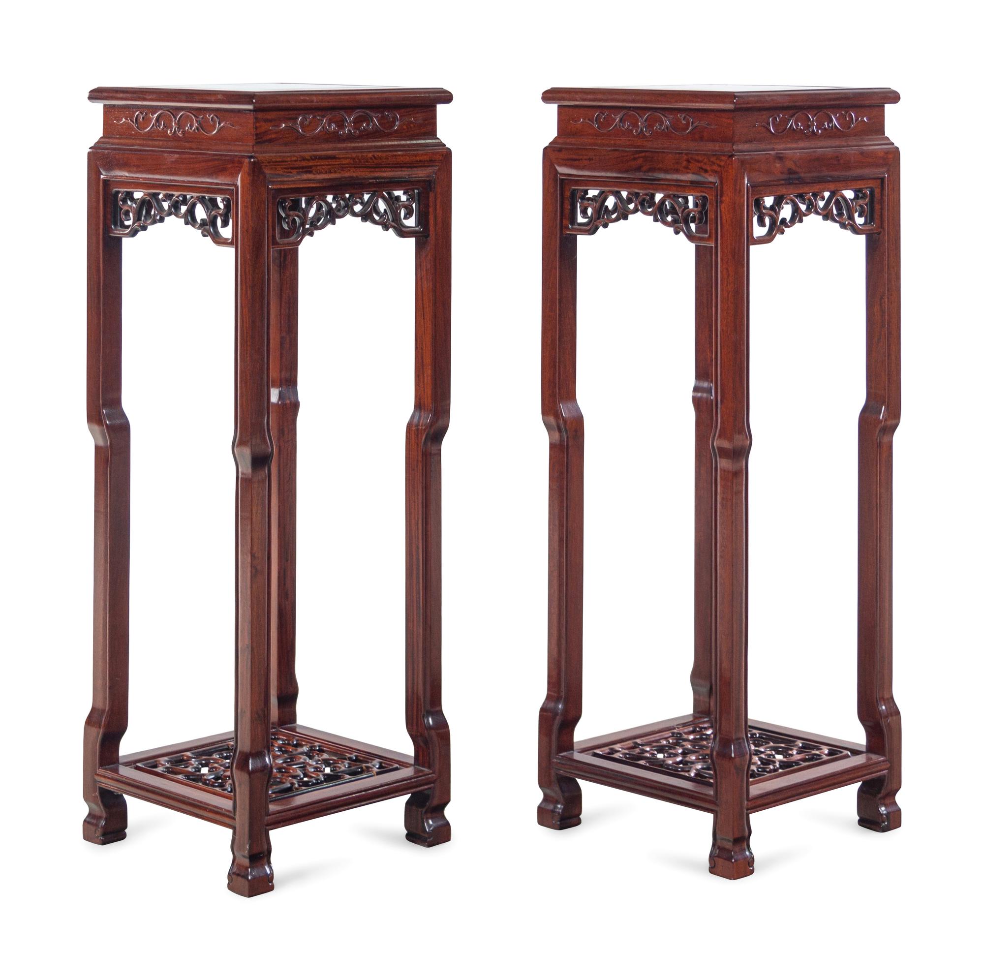 A Pair of Chinese Carved Hardwood Stands